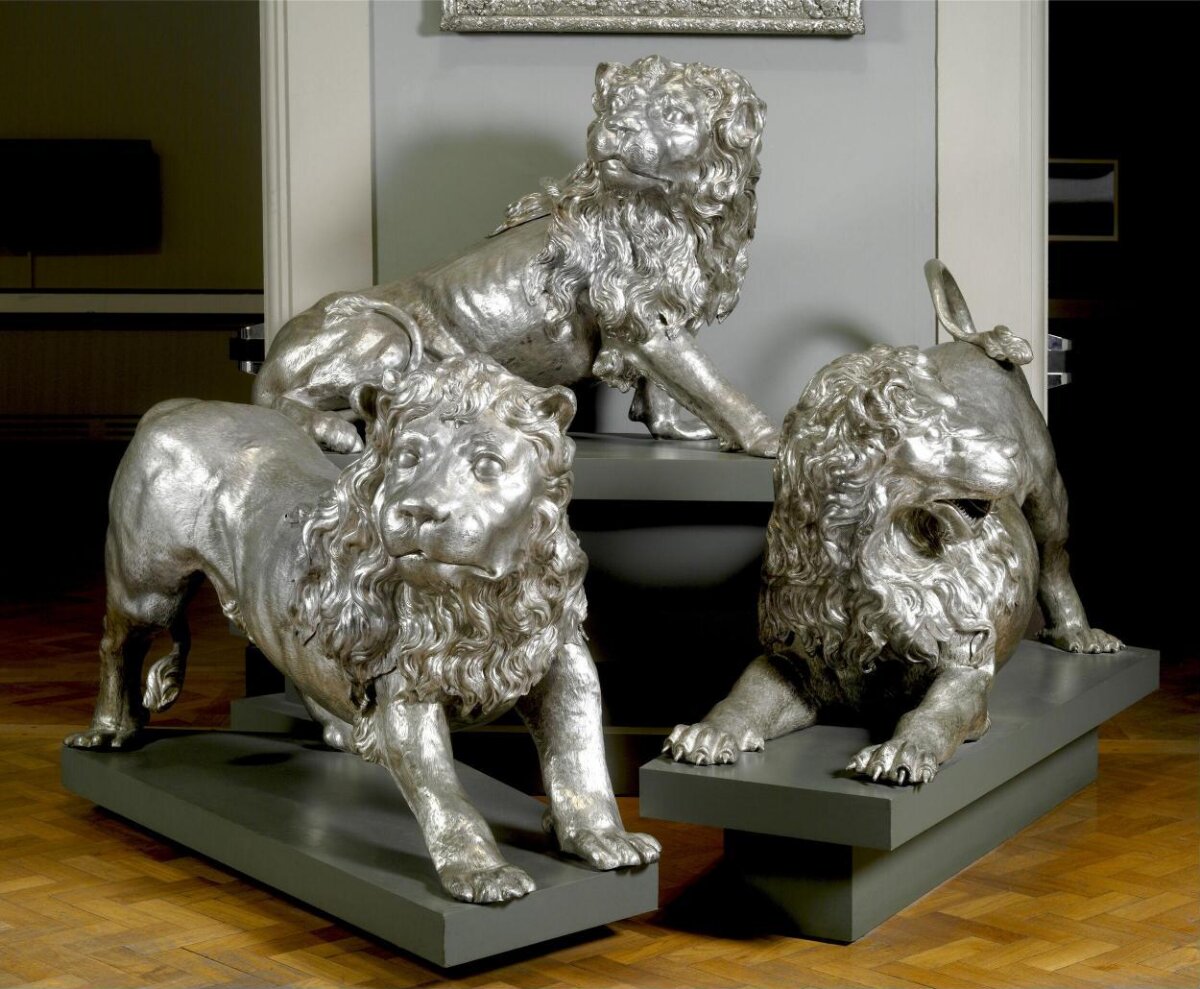 Three Silver Lion Sculptures