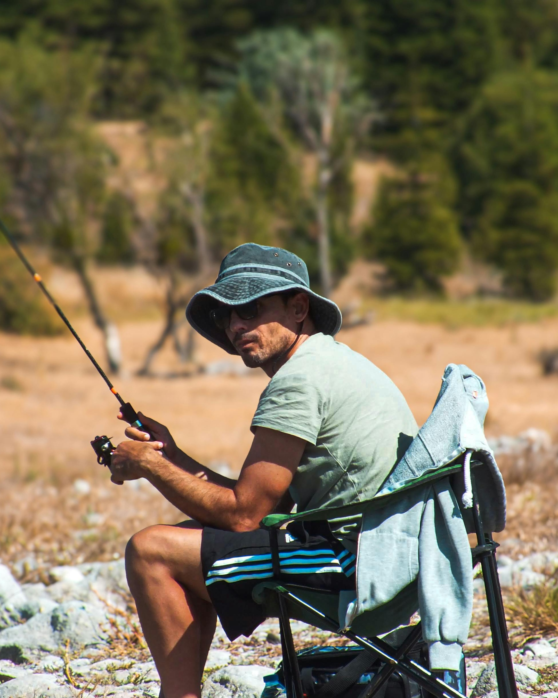 Man Relaxing While Fishing Outdoors