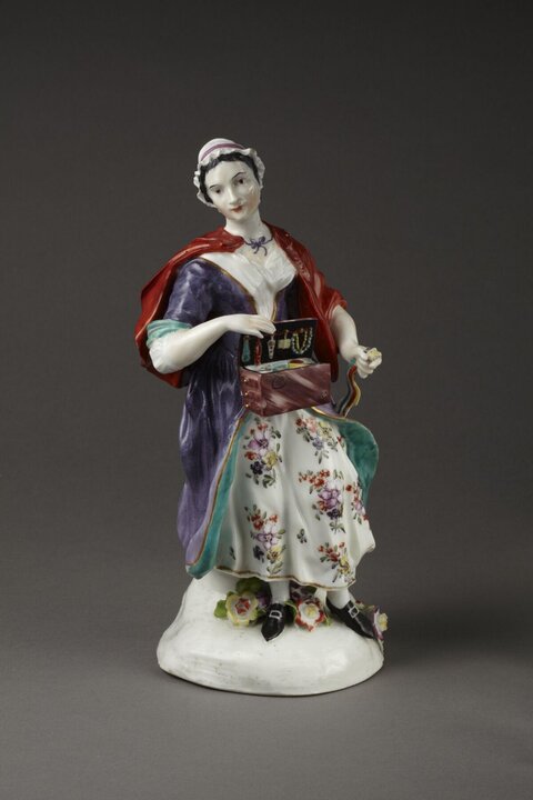 Porcelain Female Peddler Figurine