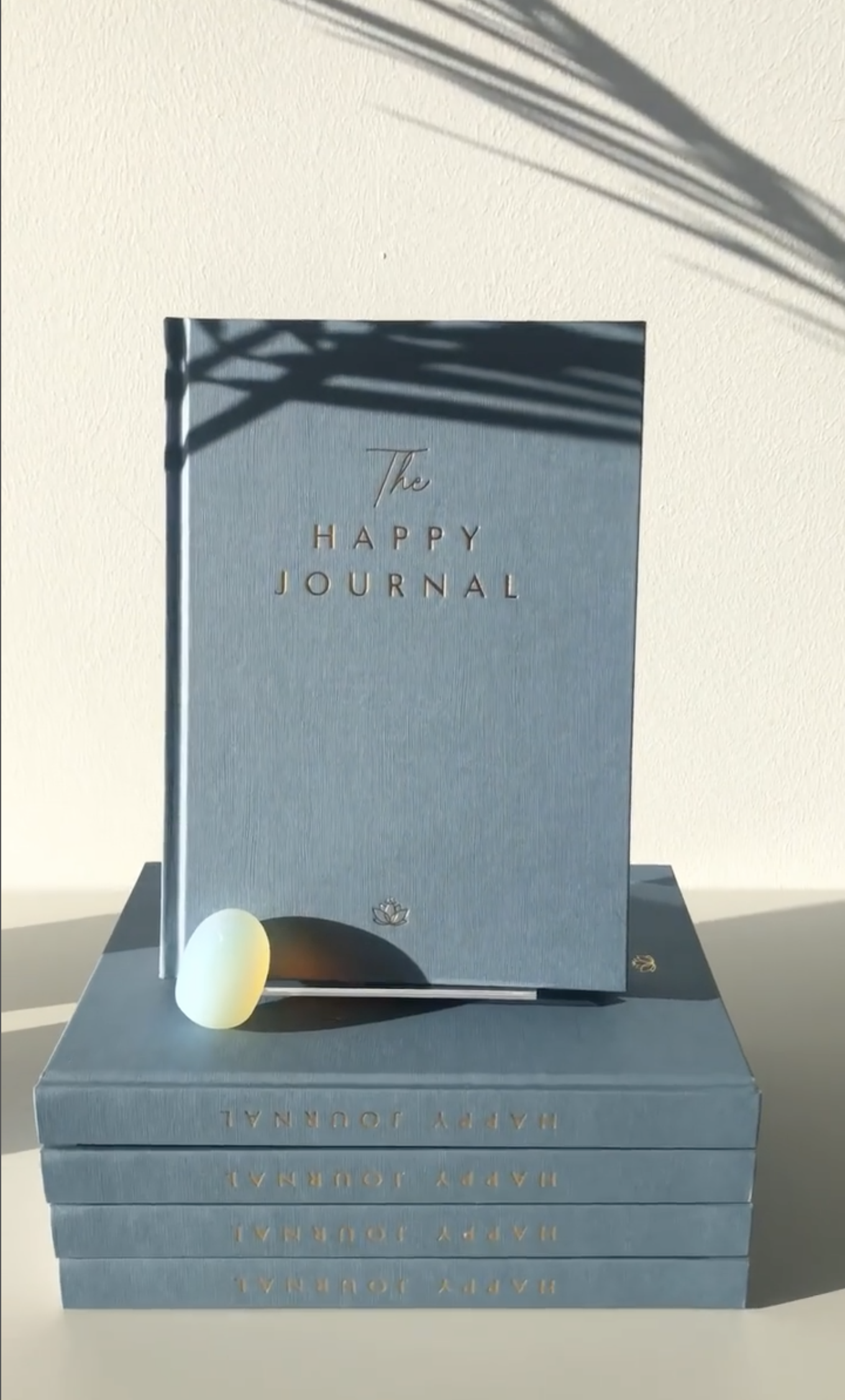 The Happy Journal Stack in Sunlight