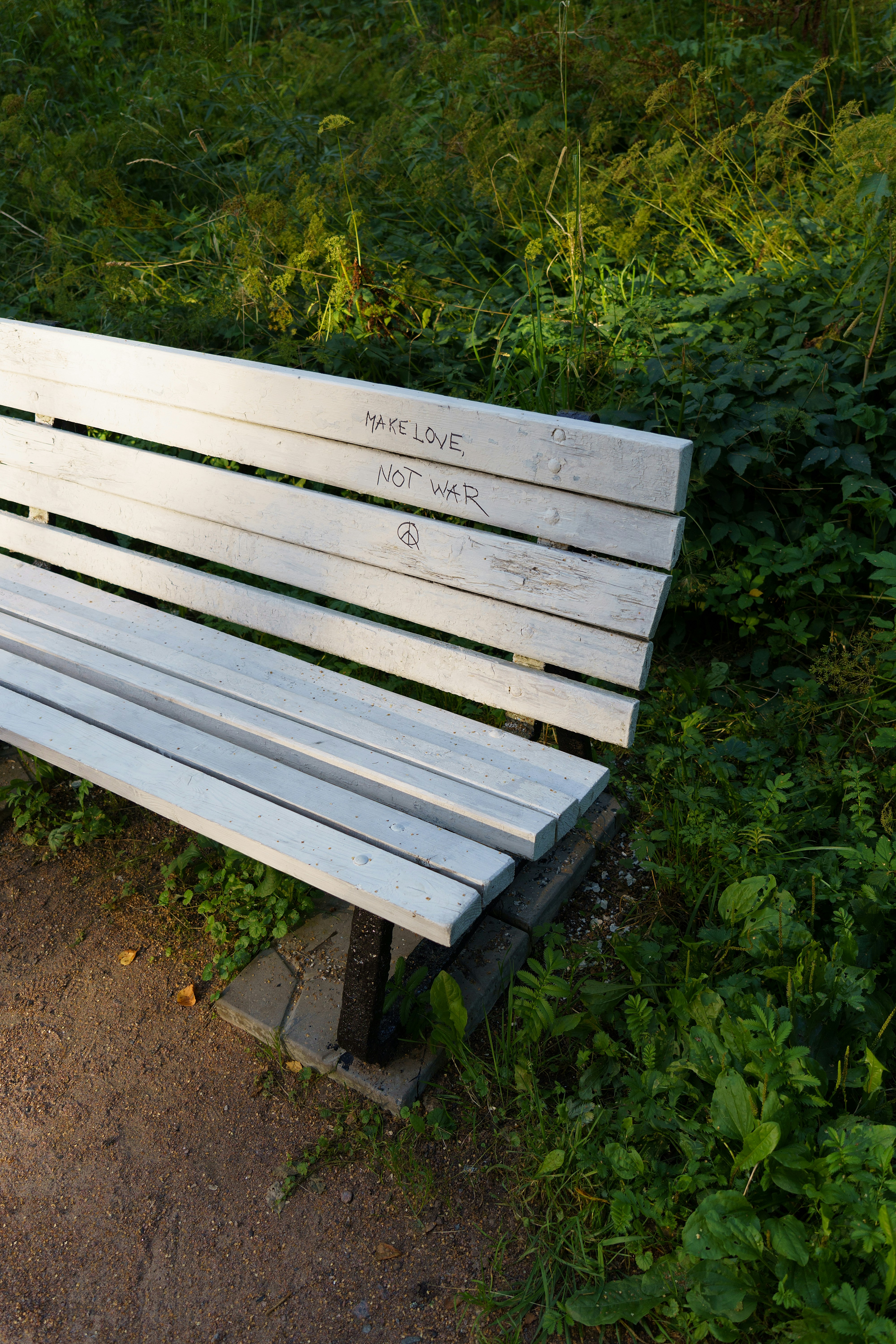 Park Bench With Make Love Not War Graffiti