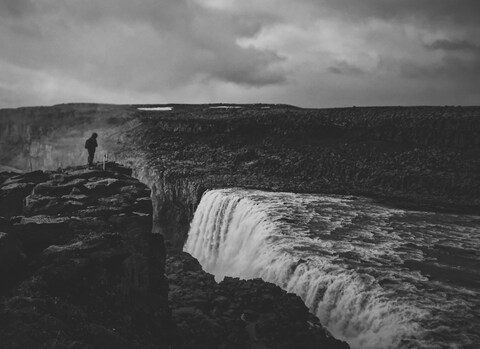 Lone Hiker Overlooking Waterfall
