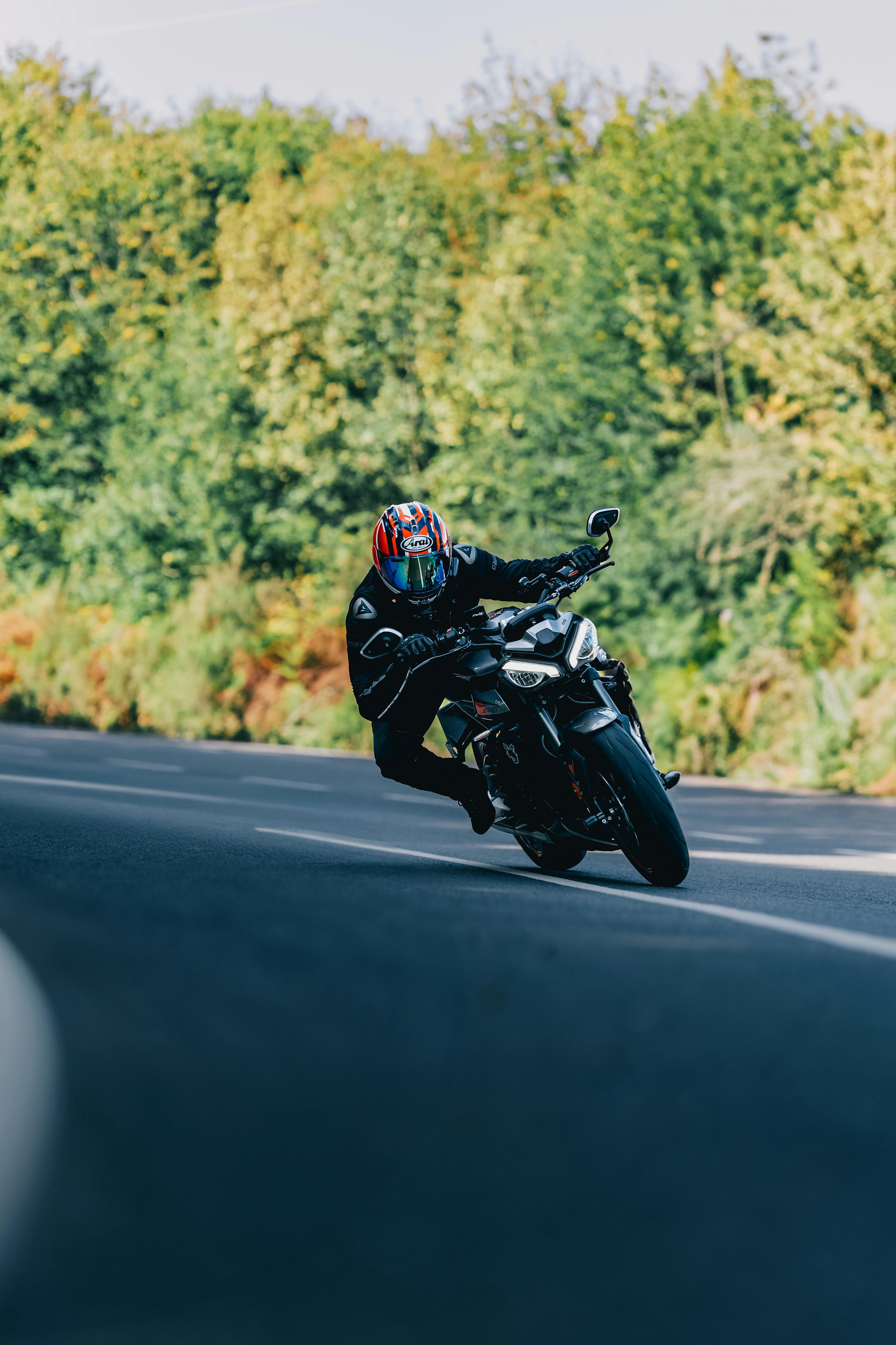 Motorcyclist Leaning Into Road Turn