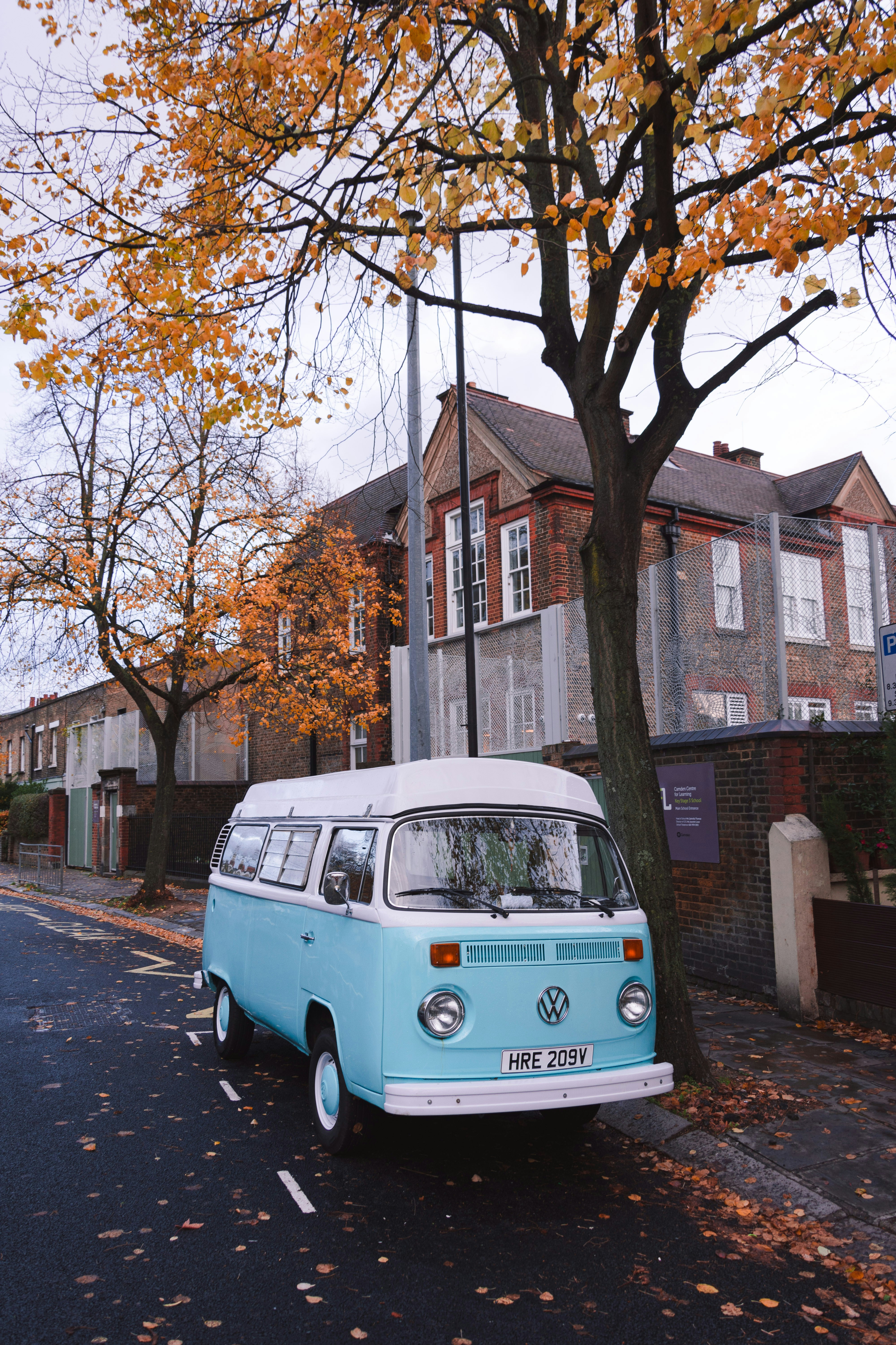 Vintage VW Van Parked on Autumn Street