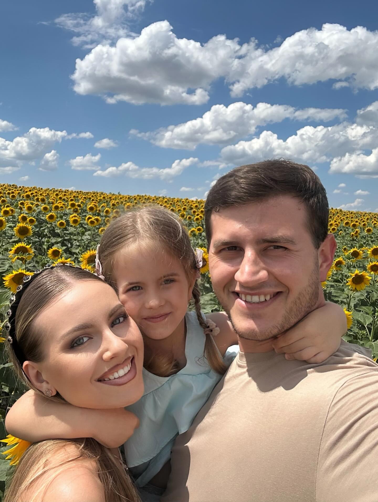Family in Sunflower Field