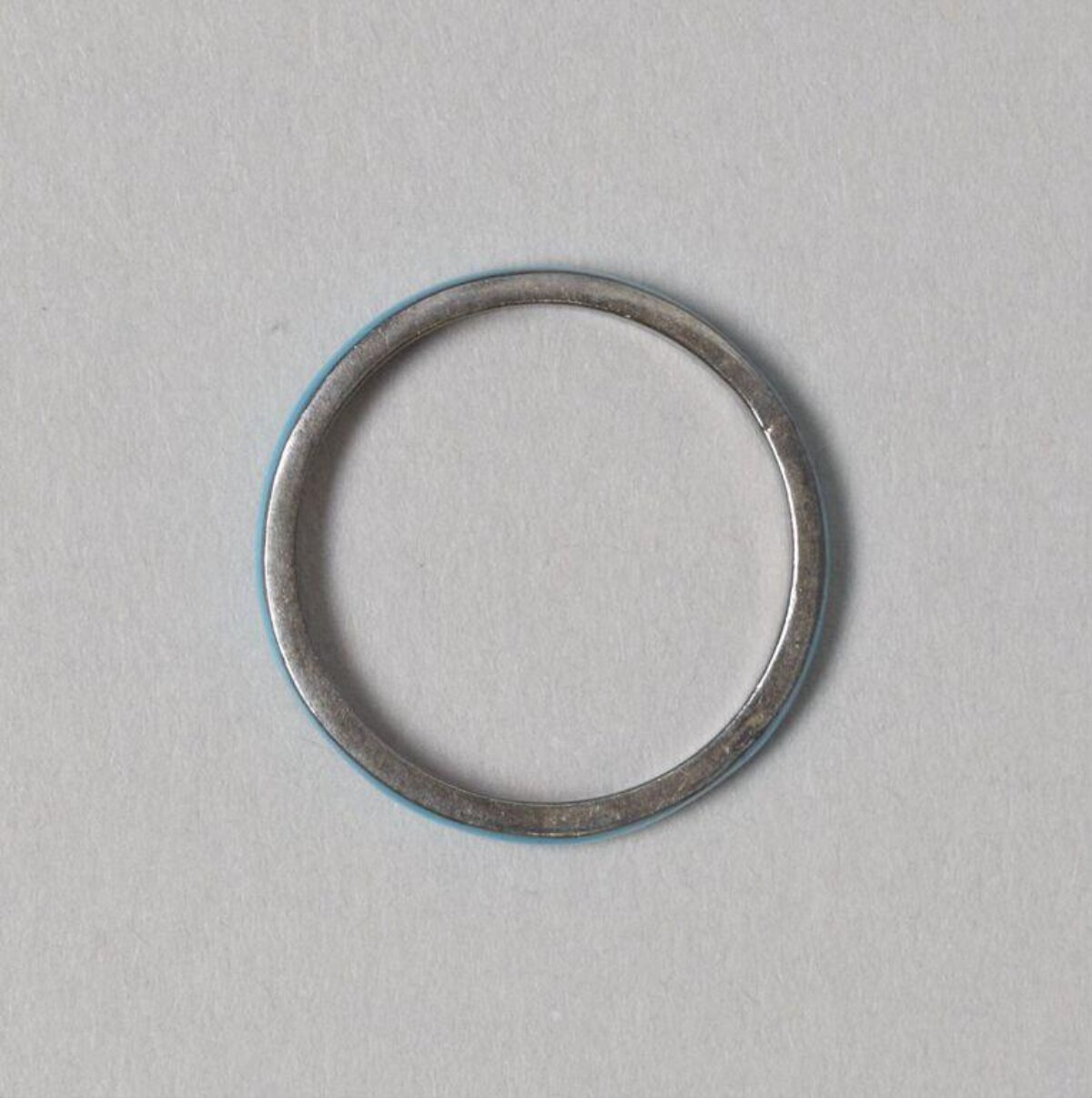 Silver Metal Ring On Gray Background