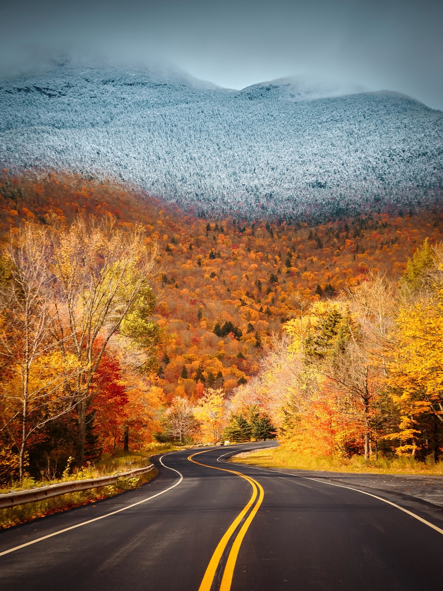 Winding Road Through Autumn Snowy Mountains