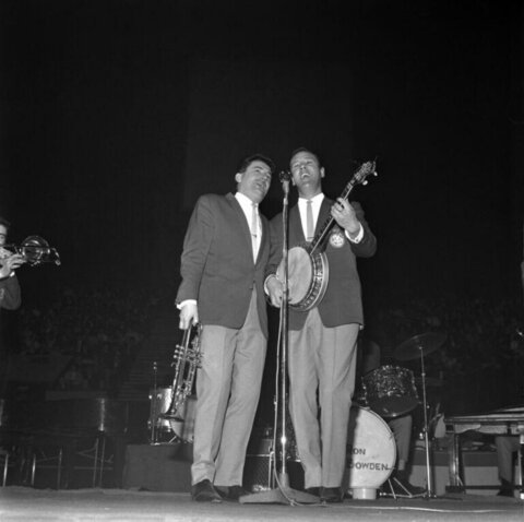 Two Musicians Performing On Stage