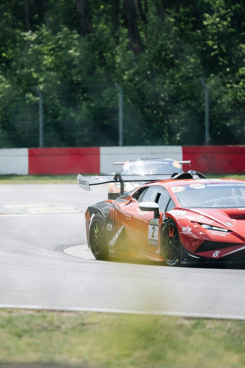 Red Race Car on Asphalt Racetrack