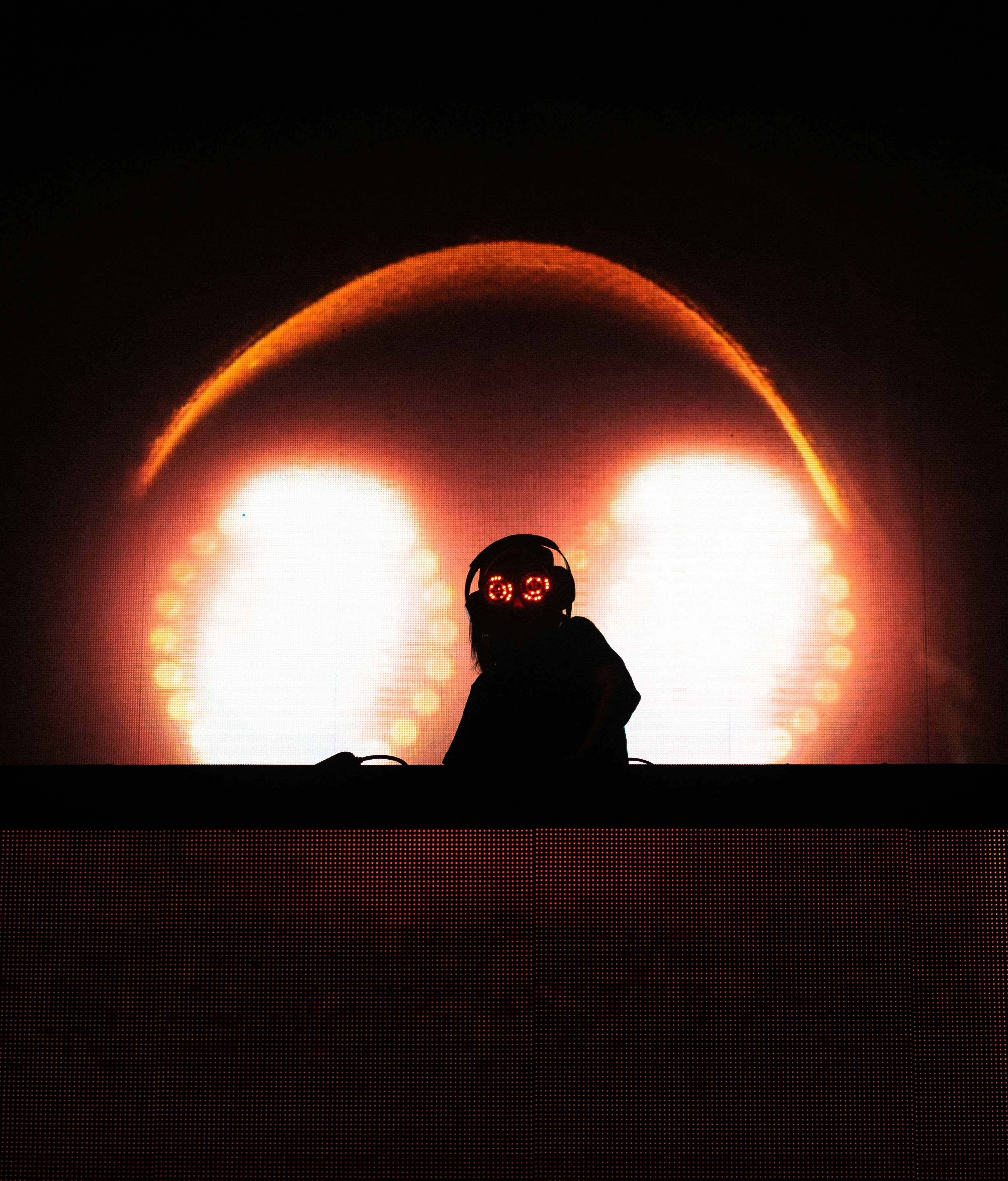 Silhouetted DJ on Concert Stage — Black Backgrounds