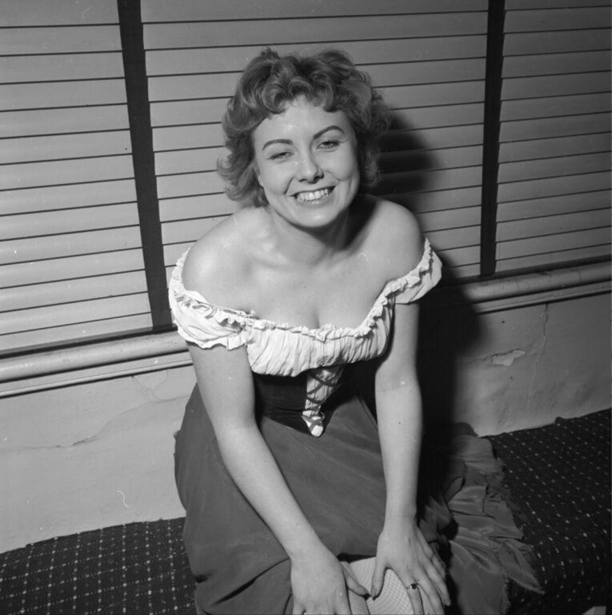 Smiling Woman in Vintage Off-shoulder Dress