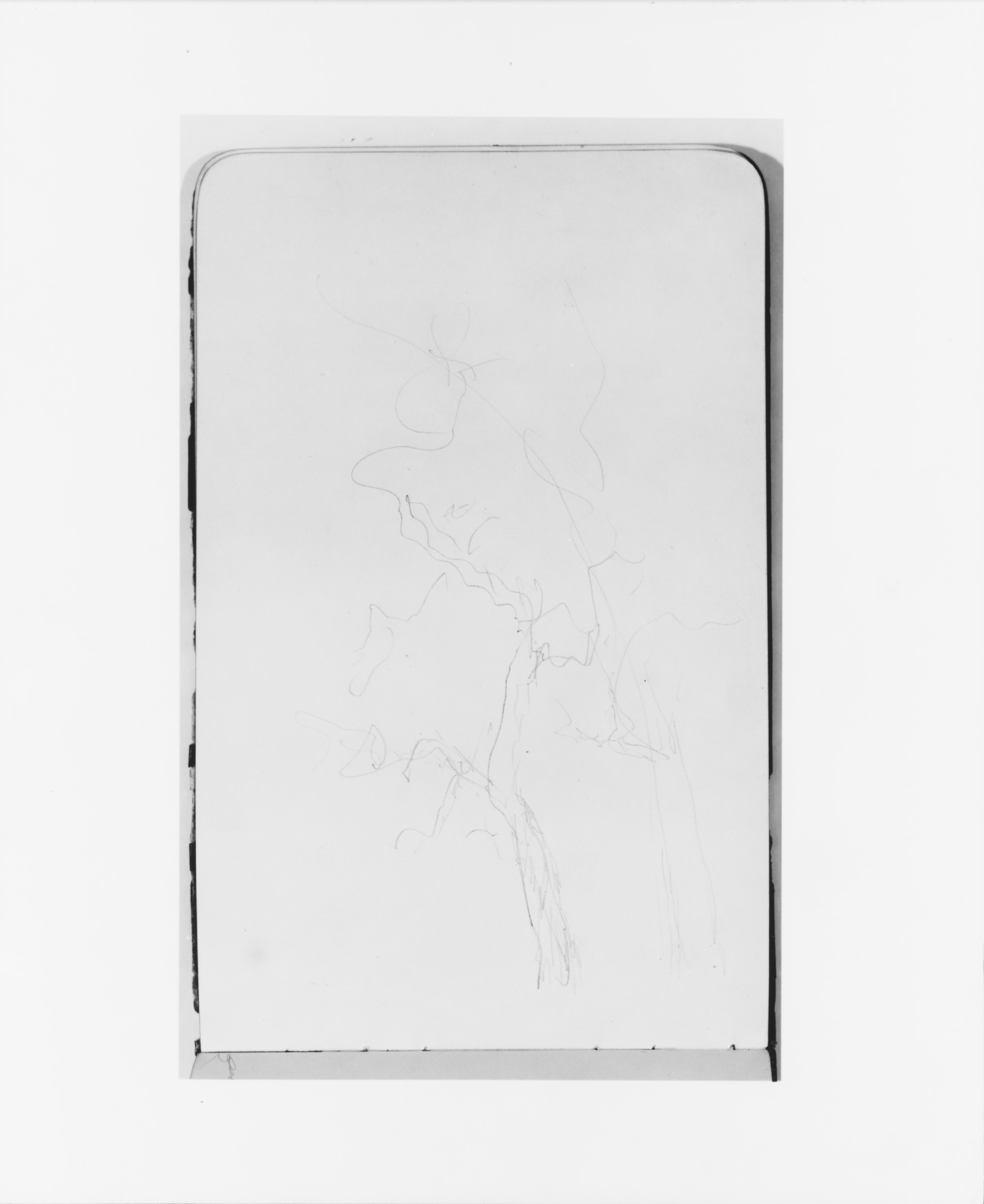 Faint Abstract Line Sketch on Notebook