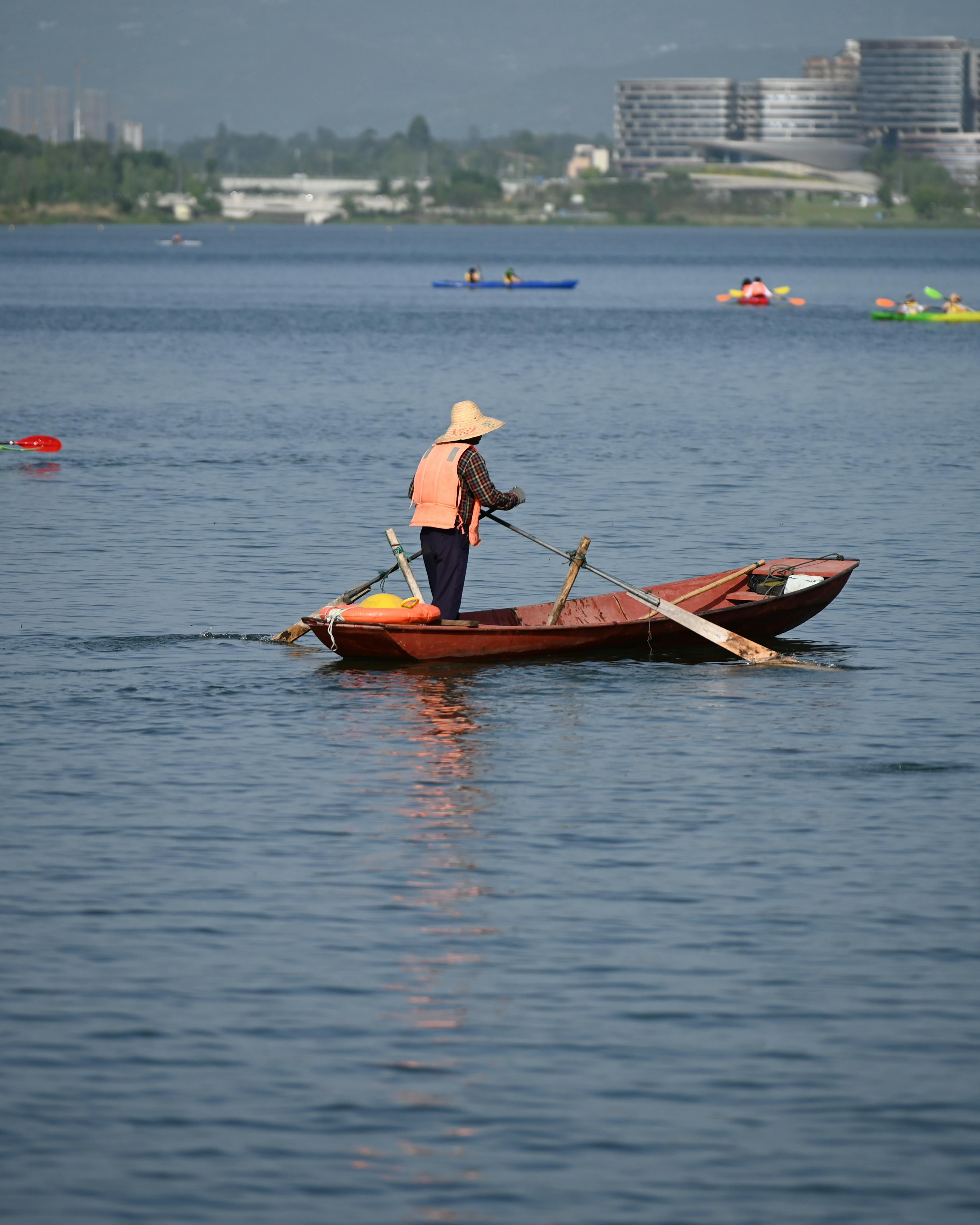 Boater Rowing on Calm Lake
