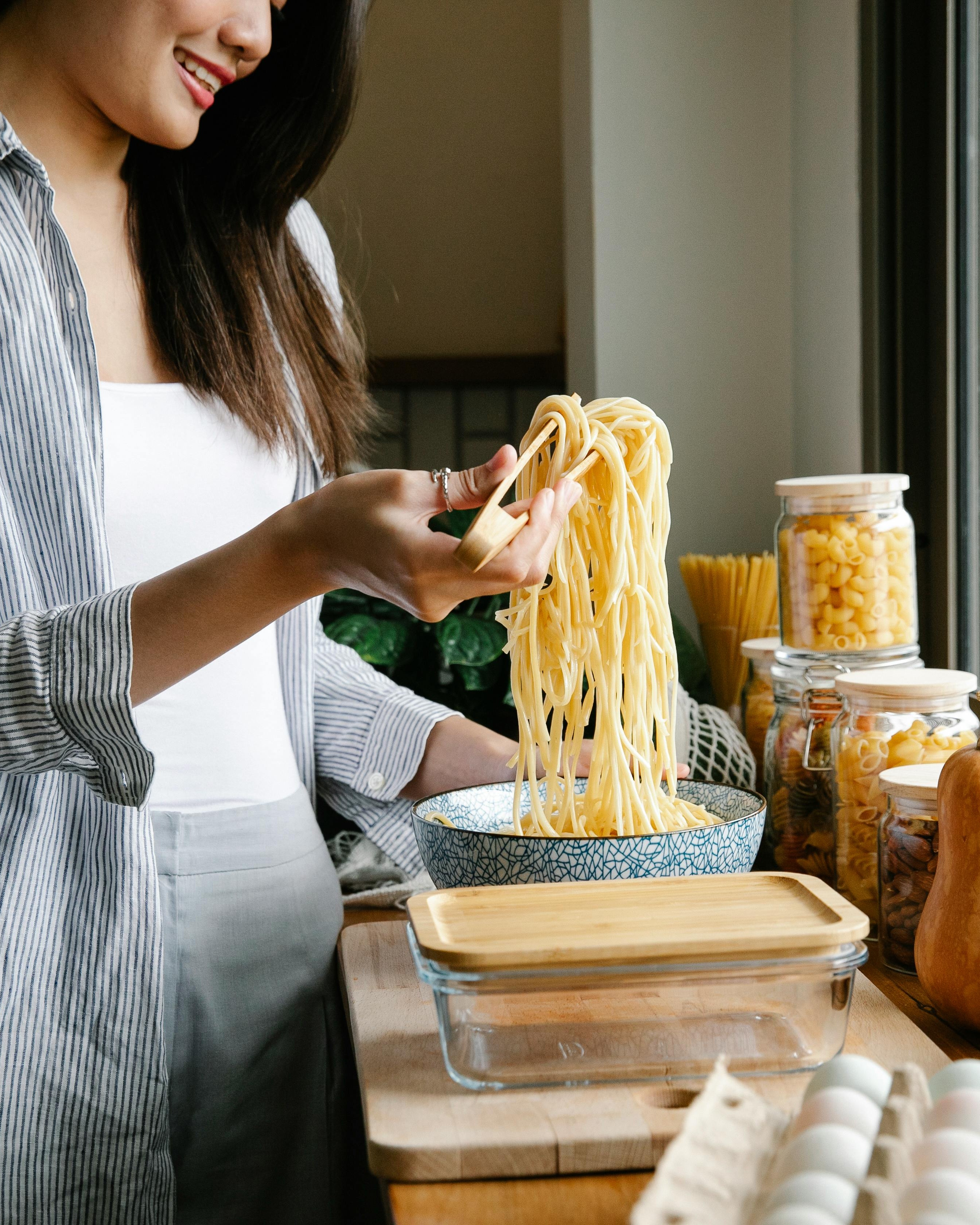 Woman Preparing Cooked Spaghetti