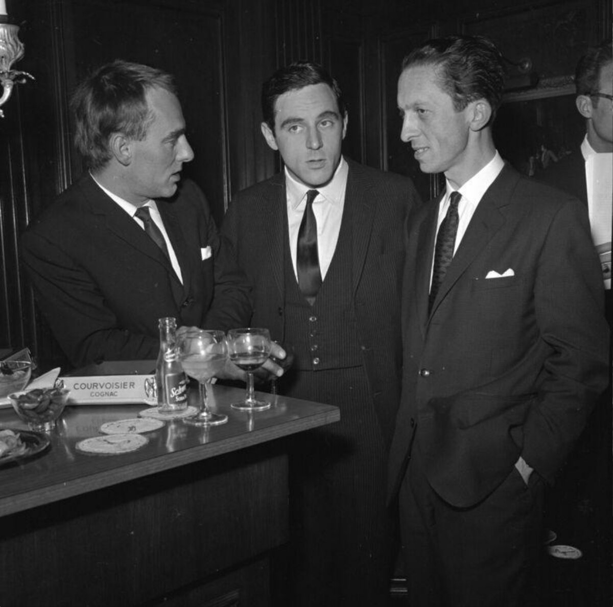 Three Men at a Bar Counter