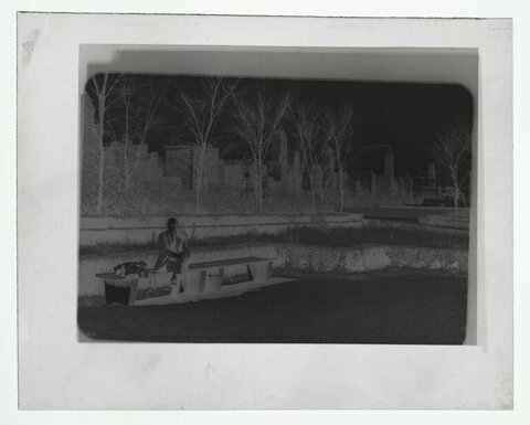 Man on Park Bench with City Skyline