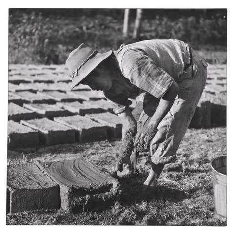 Worker Hand Making Mud Bricks