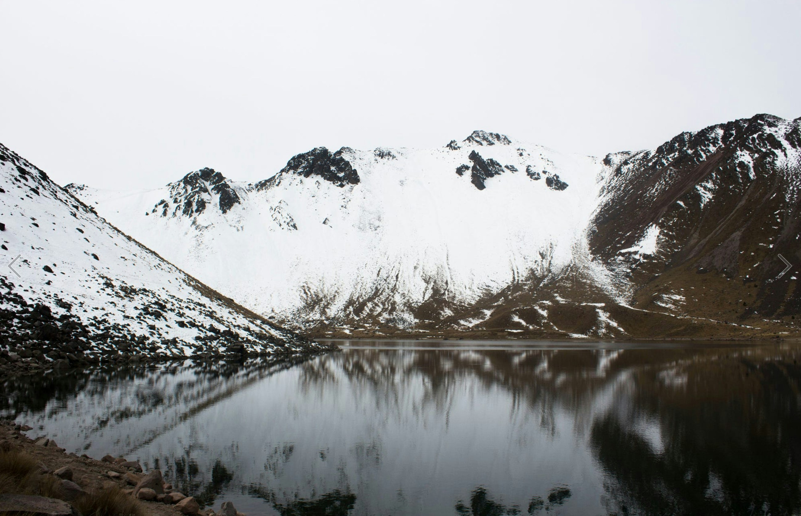 Snow-capped Mountain Lake Reflection