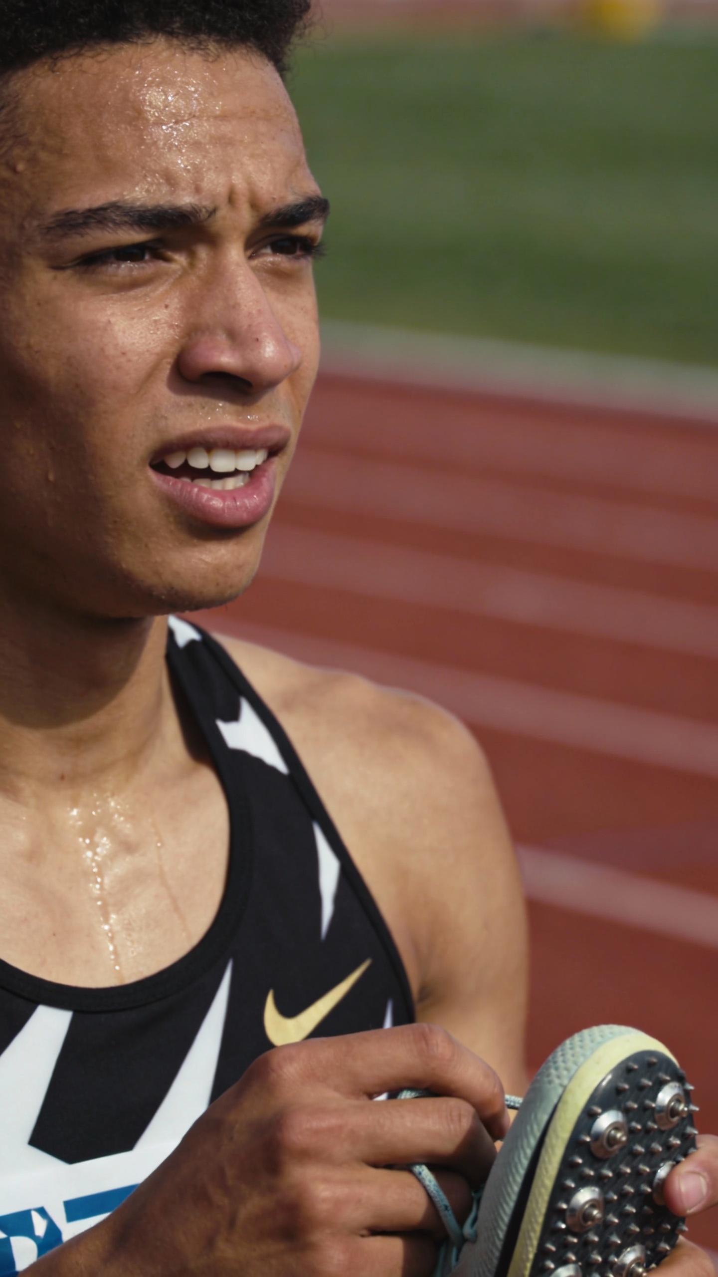 Track Athlete Tying Sprint Spikes