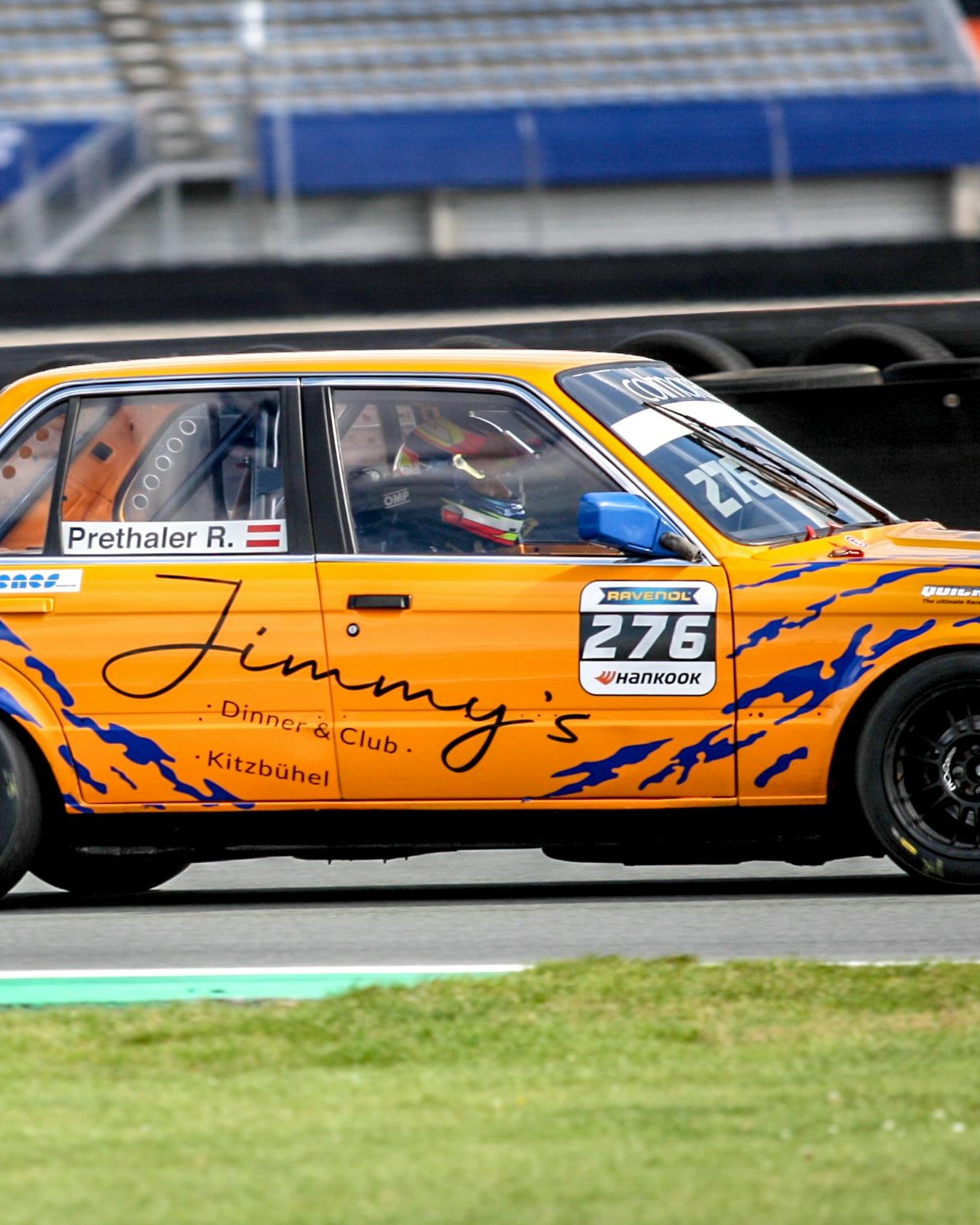 Orange Race Car 276 on Race Track