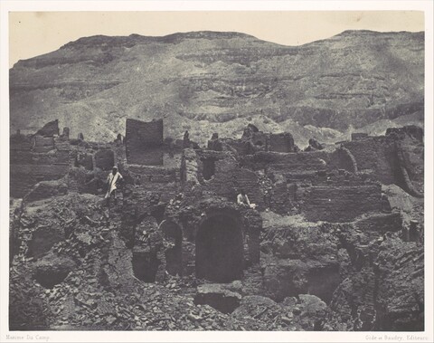 Ancient Ruins Against Desert Mountains