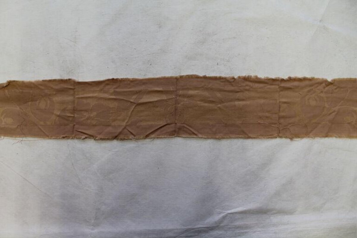 Brown Fabric Strip on Textured Canvas
