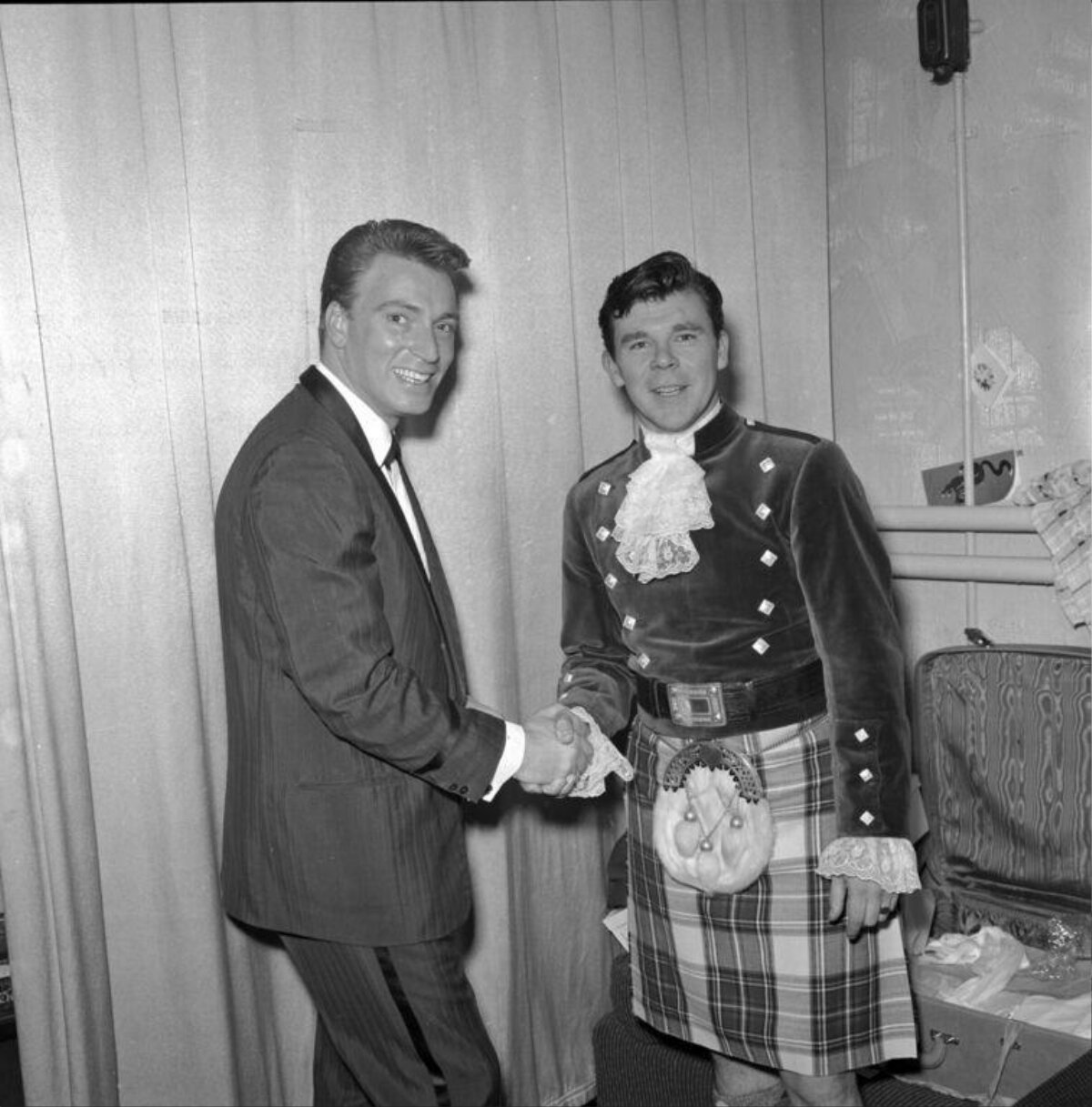 Two Men Shaking Hands Backstage