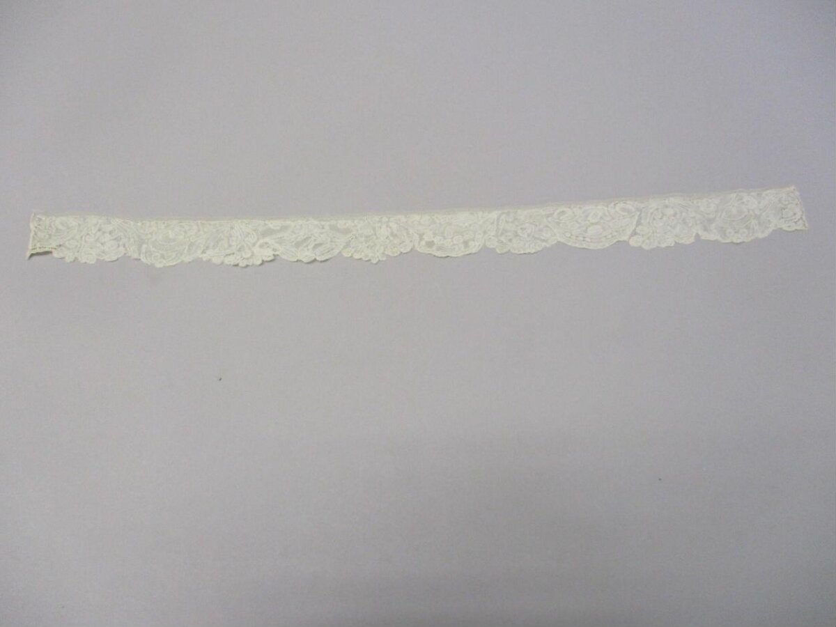 Cream Lace Trim on Plain Gray Background