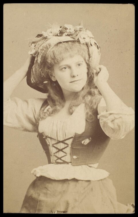 Vintage Portrait of Woman Adjusting Hat