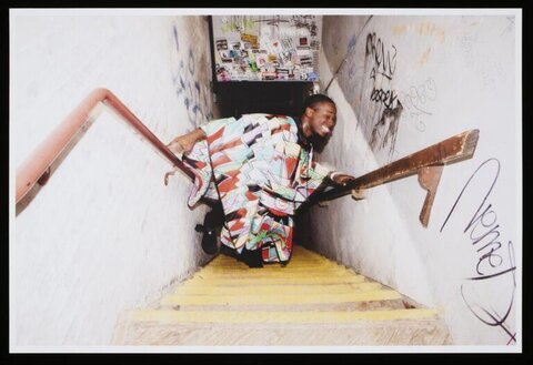 Man Stuck Between Stair Handrails