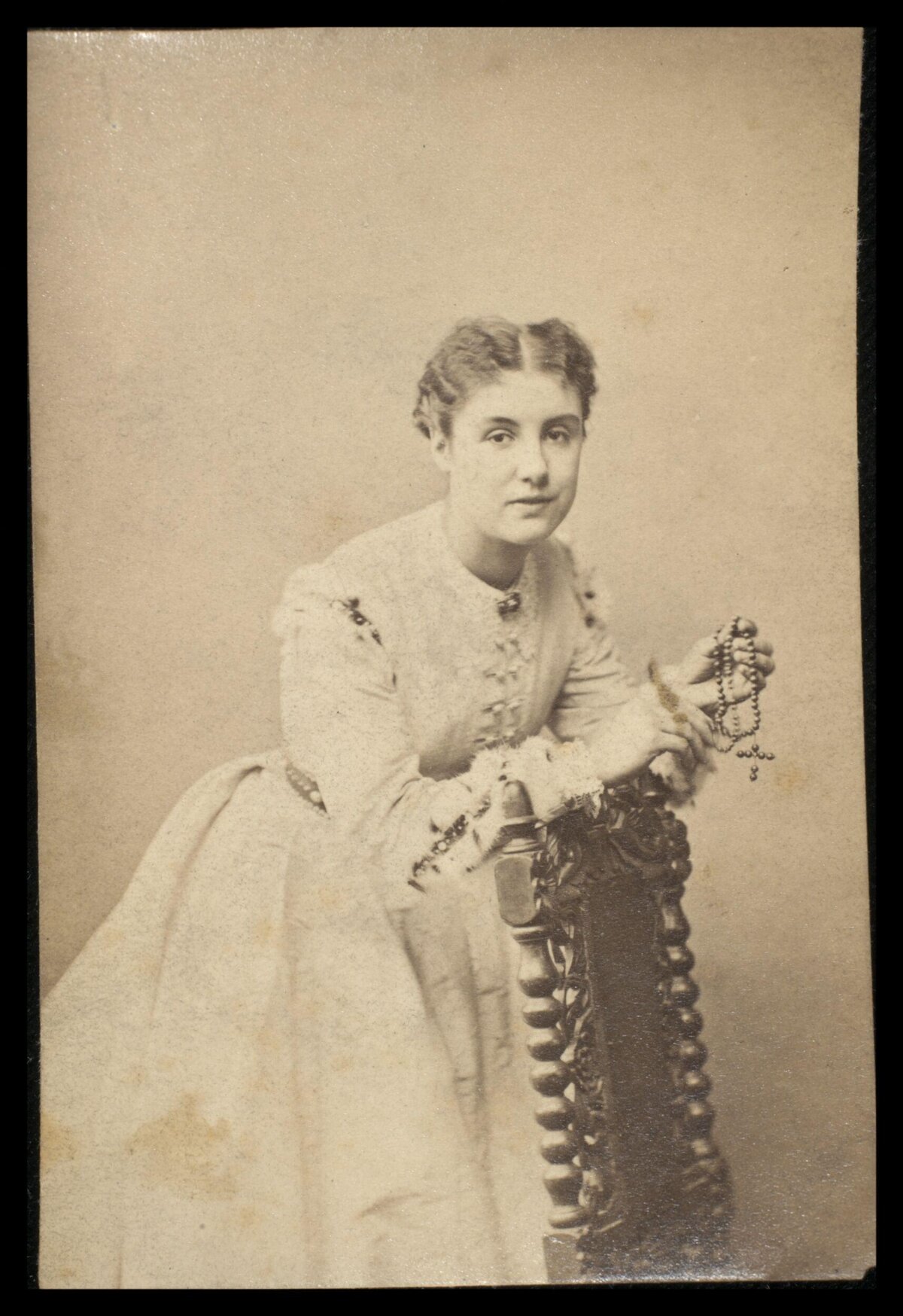 Vintage Portrait of Woman Holding Rosary