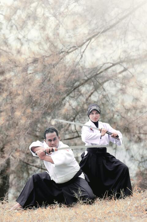 Two Martial Artists with Katana in Stance