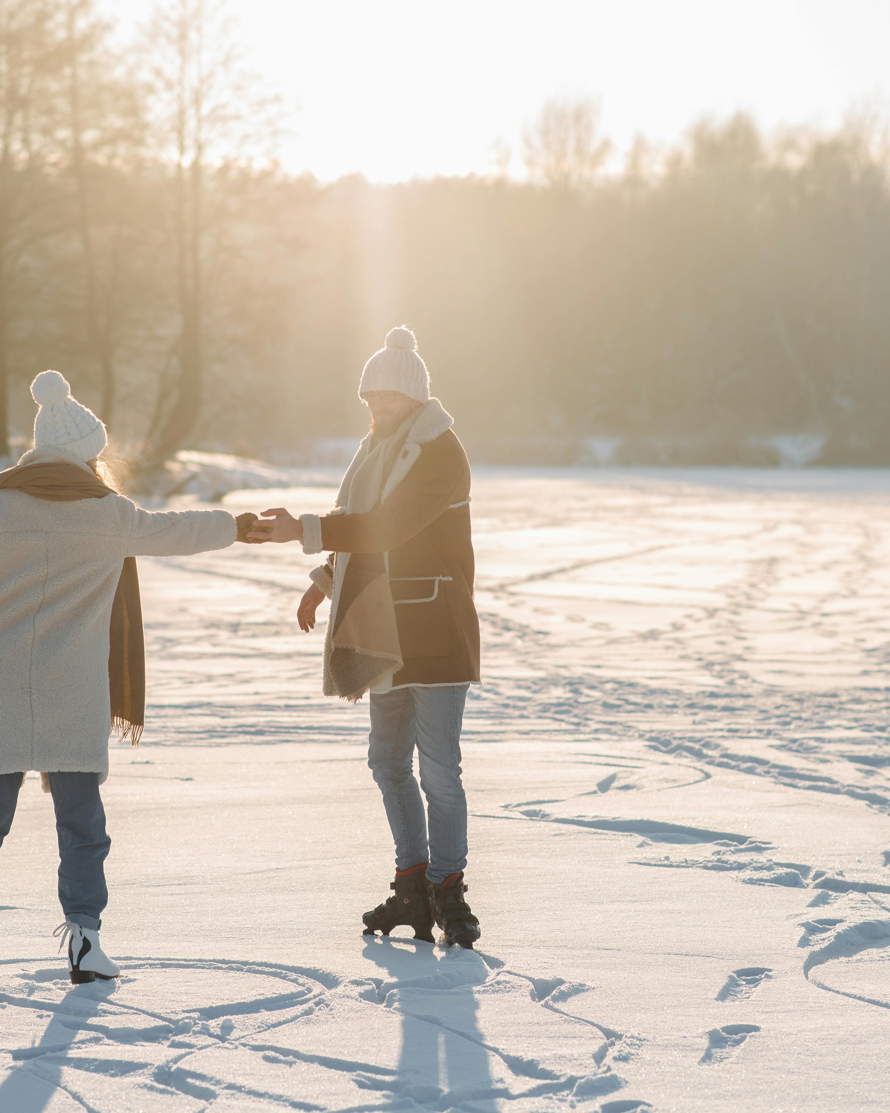 Couple Ice Skating on Frozen Lake