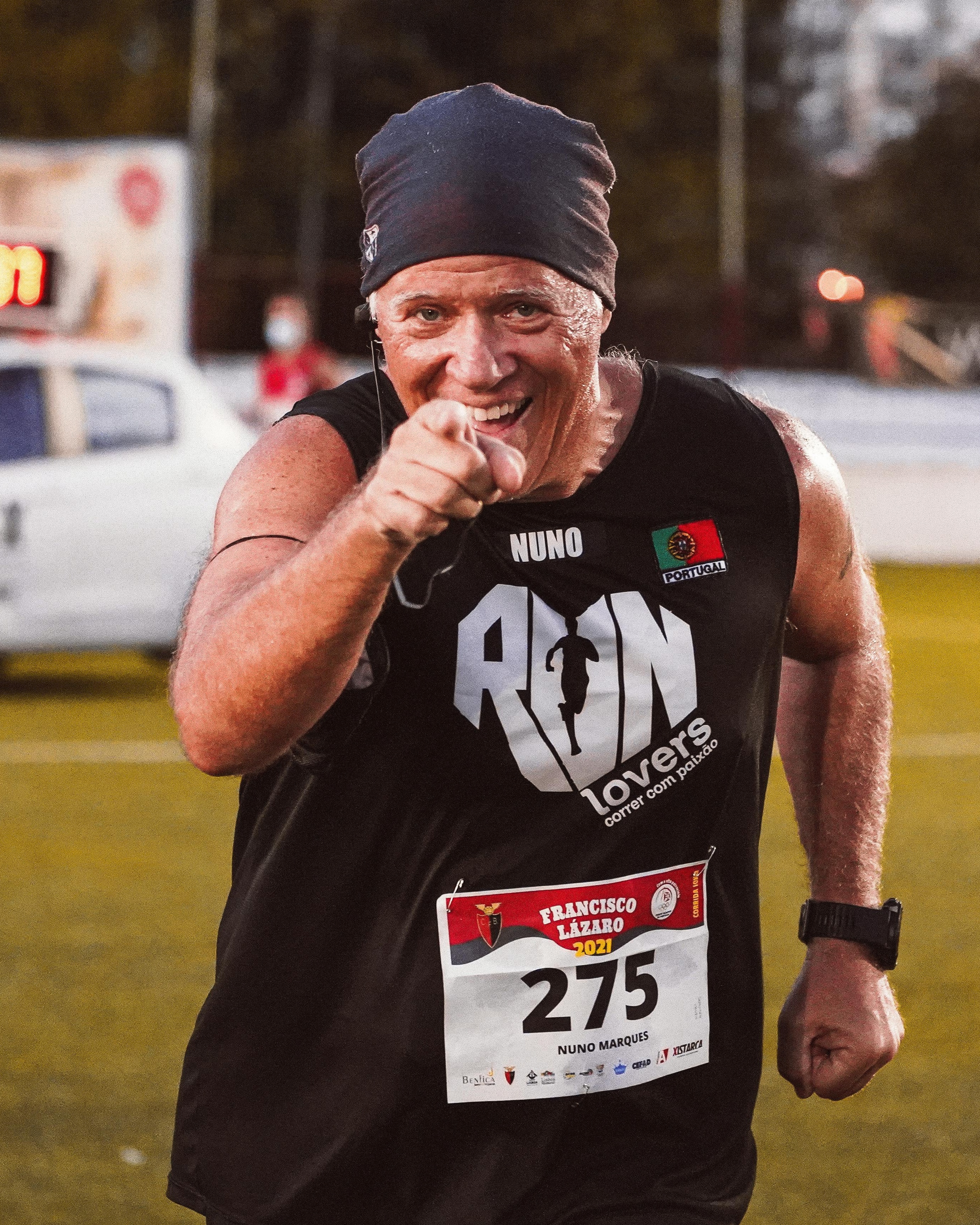 Smiling Runner Points At Race Event