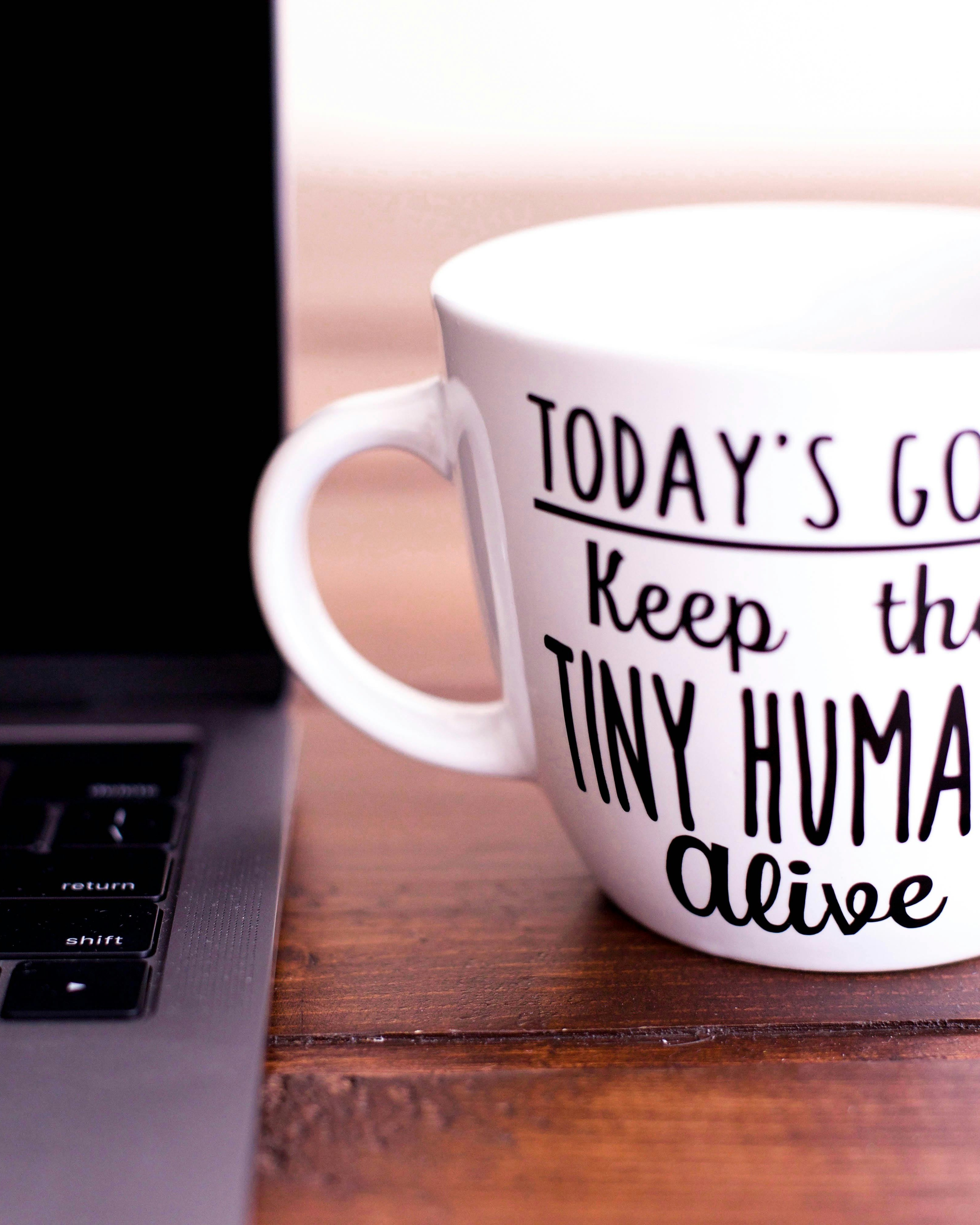 Funny Parenting Coffee Mug on Desk