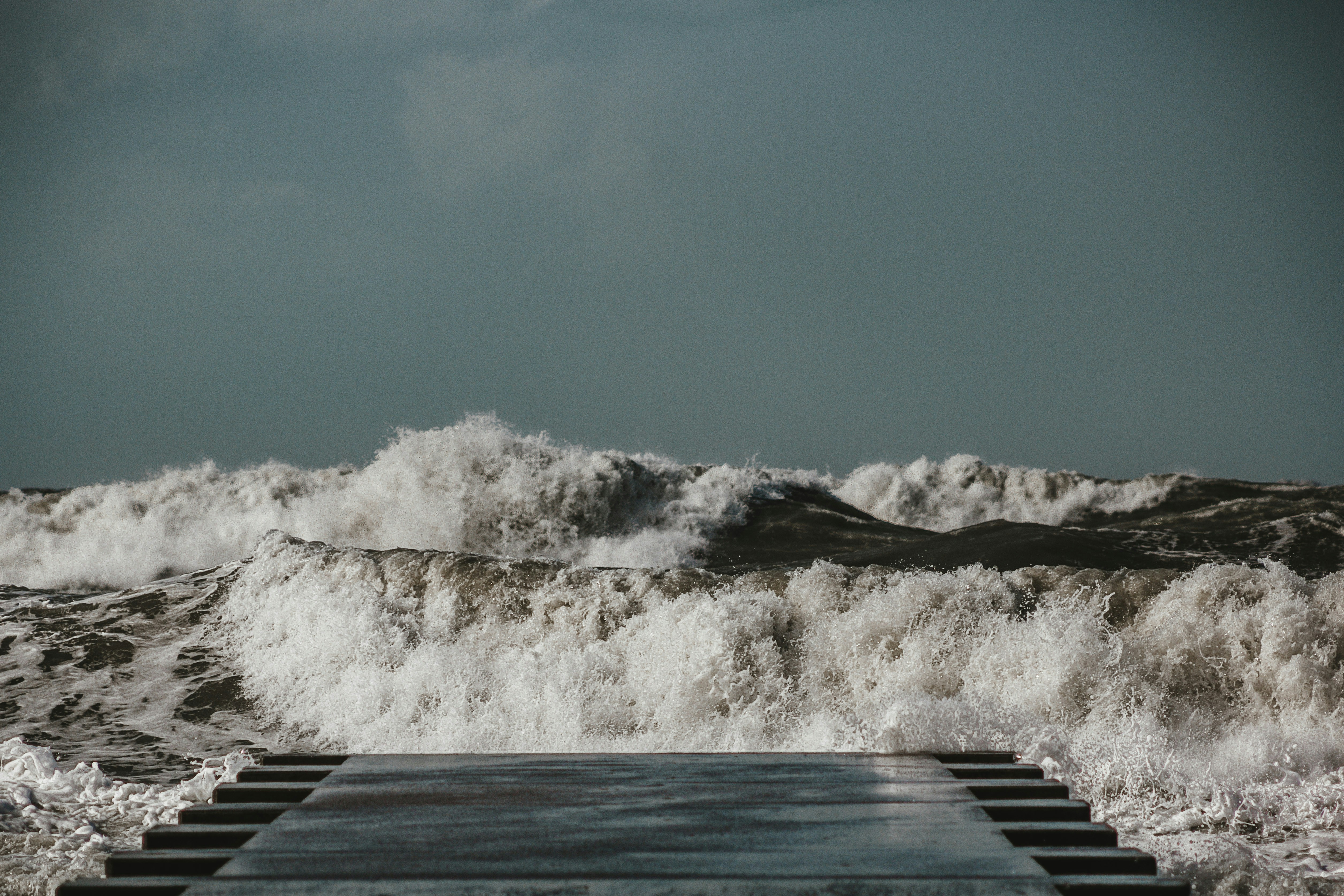 Stormy Sea Waves by Wooden Pier