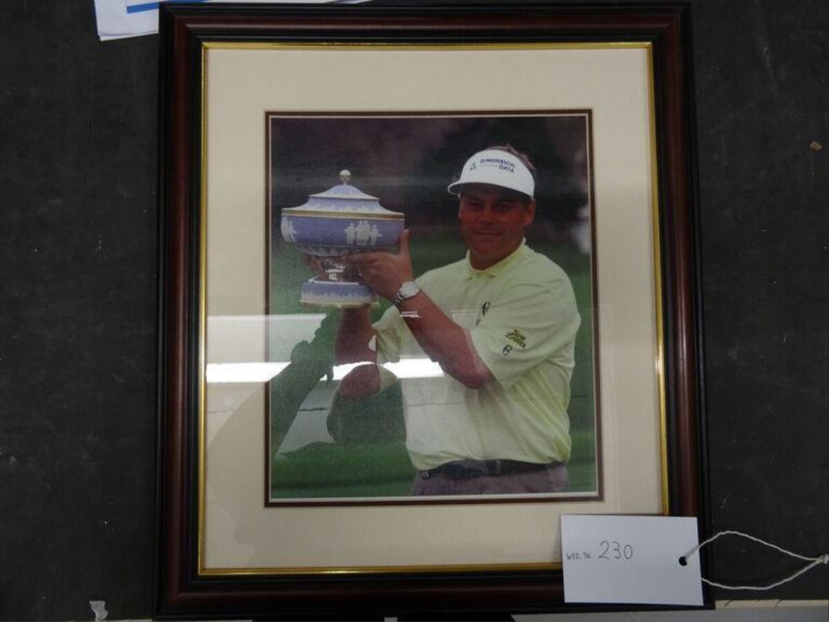 Framed Photo of Golfer With Trophy