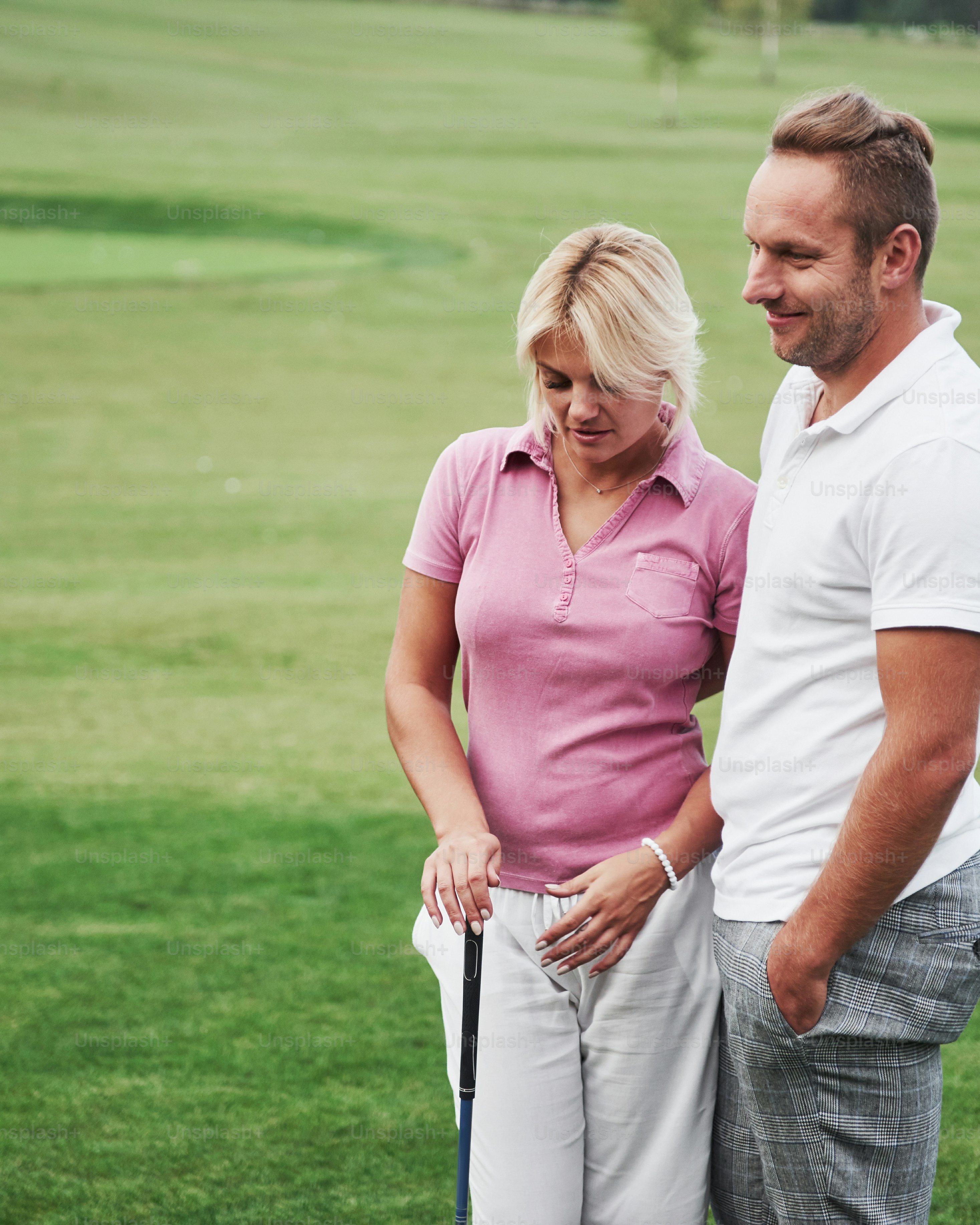 Couple Relaxing on Golf Course
