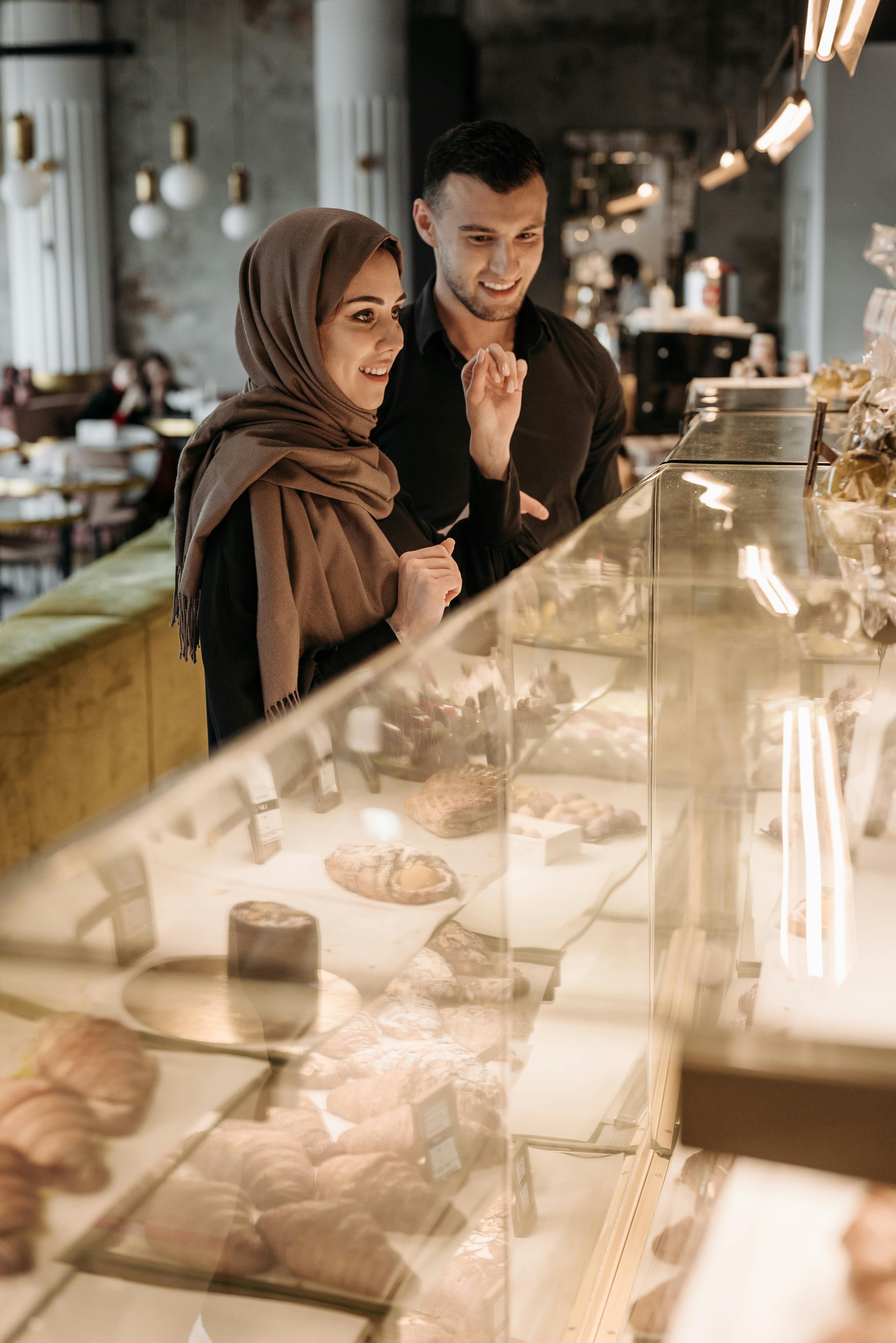 Couple Browsing Pastries at Bakery Cafe