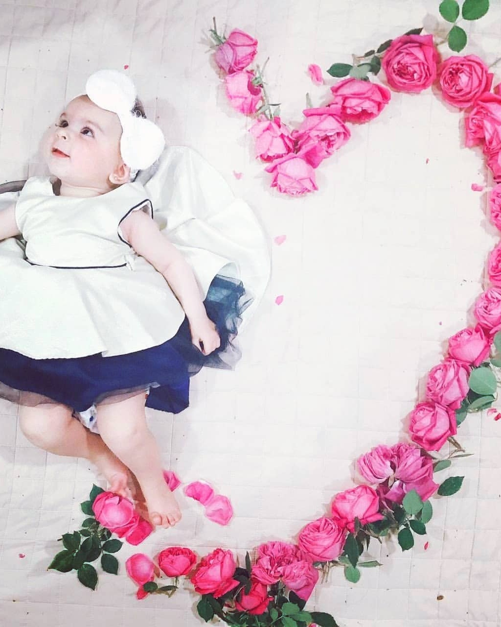 Baby Beside Pink Rose Heart