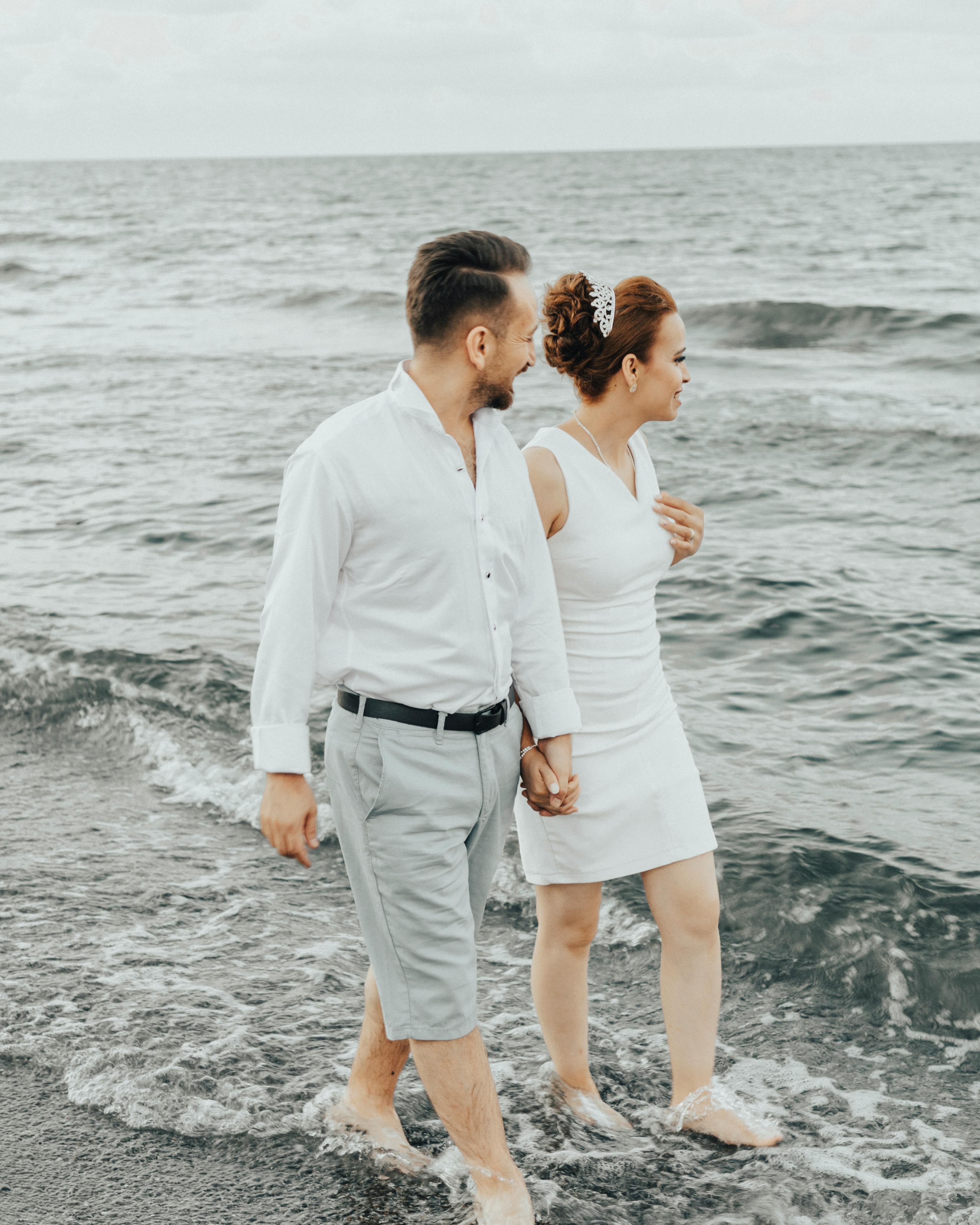 Bridal Couple Walking at Seashore