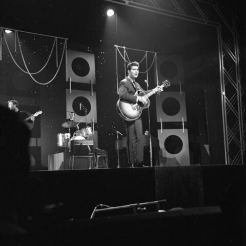 Rock Band Performing On Stage