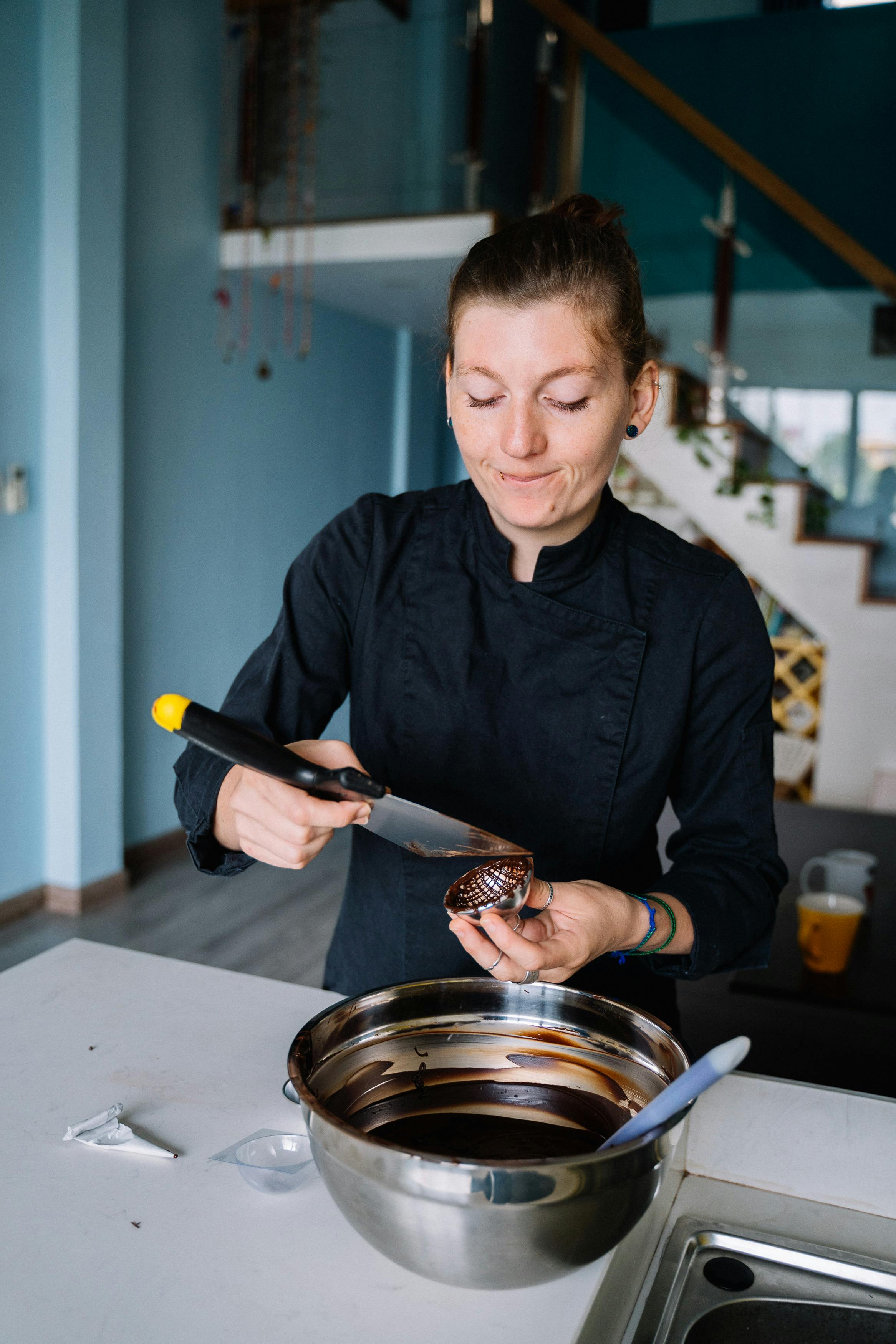 Chocolatier Working With Melted Chocolate