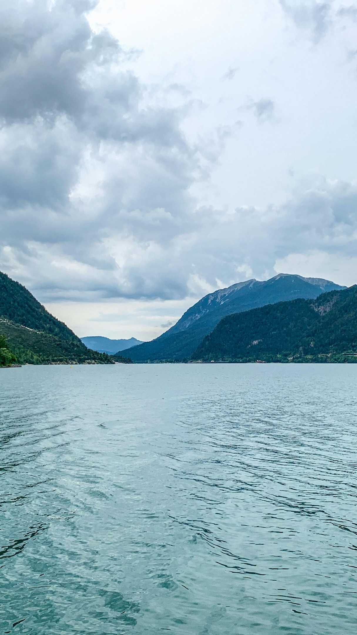 Mountain Lake Under Cloudy Sky