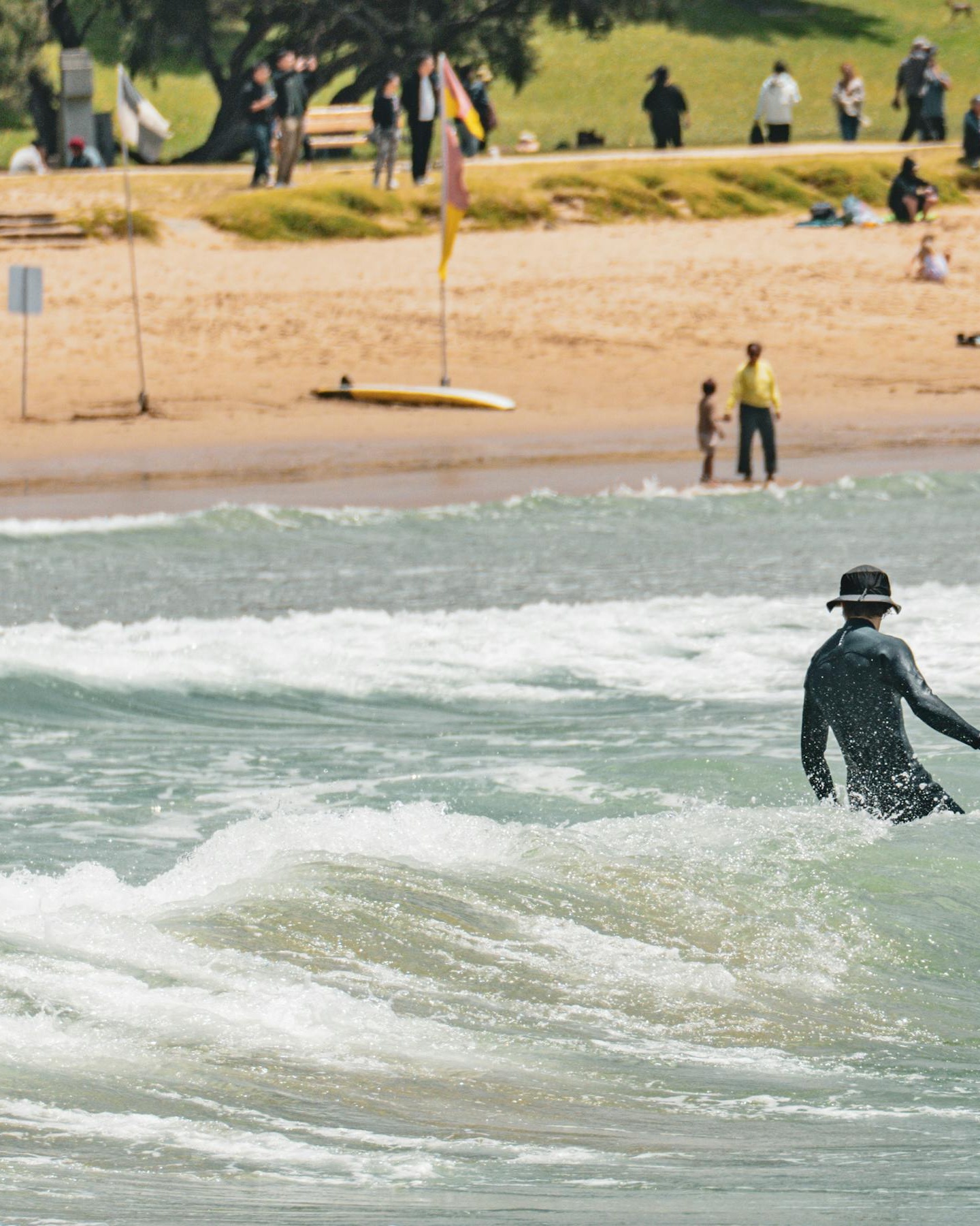 Surfer in Sea Waves at Beach