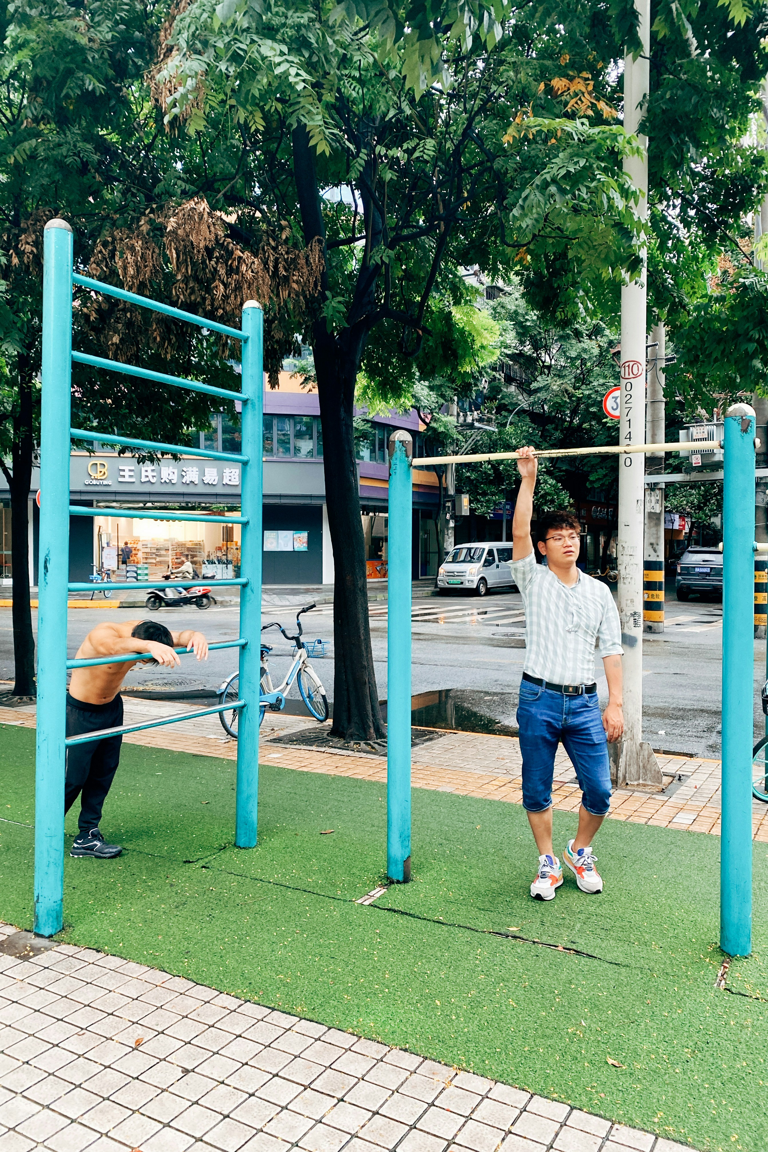 Two Men Exercising at Outdoor Gym