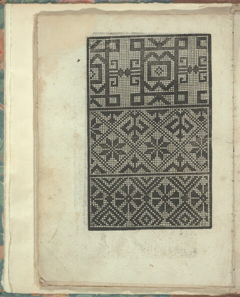 Antique Cross-Stitch Pattern on Old Book Page