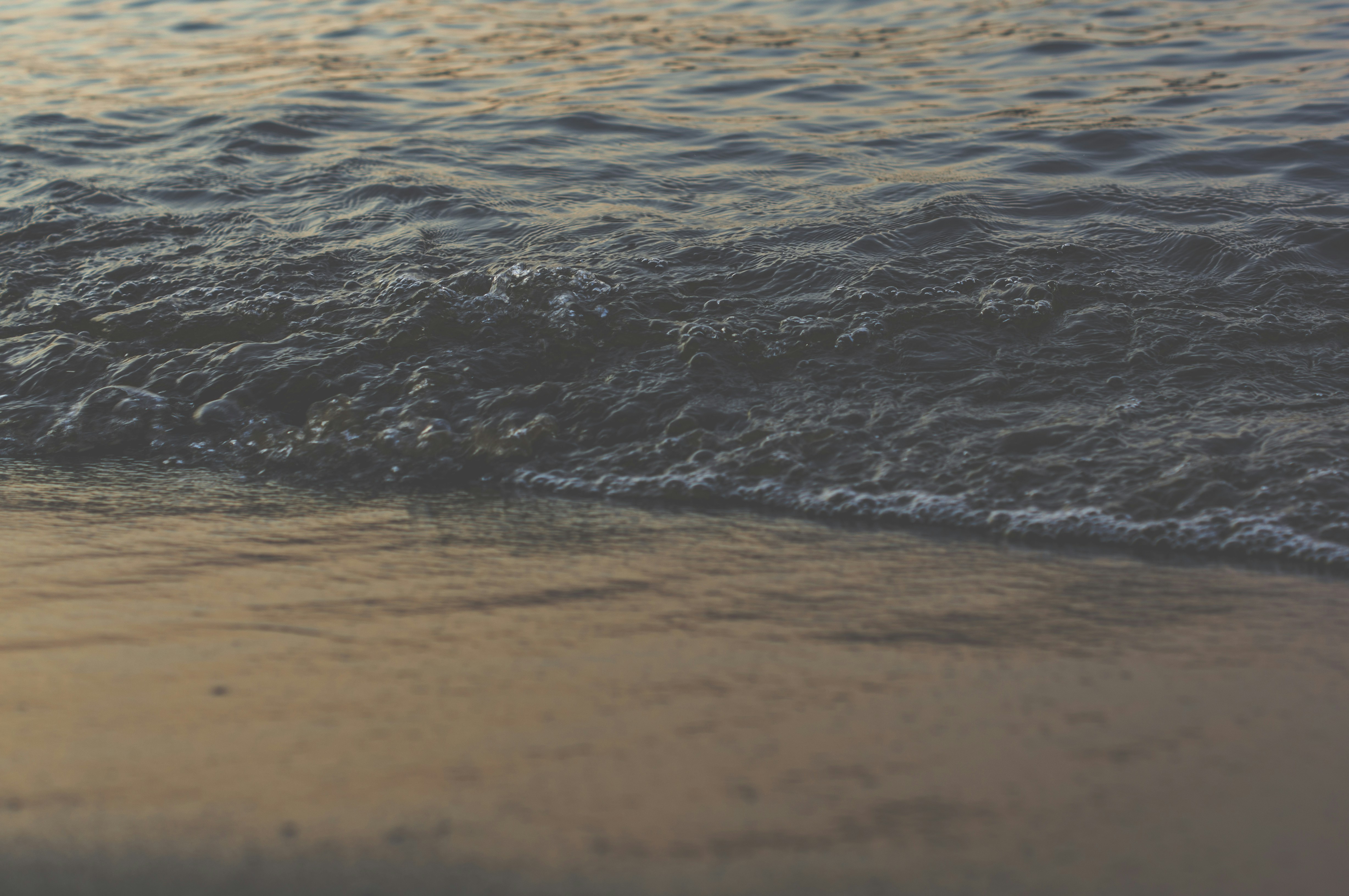 Waves Washing Sandy Shore