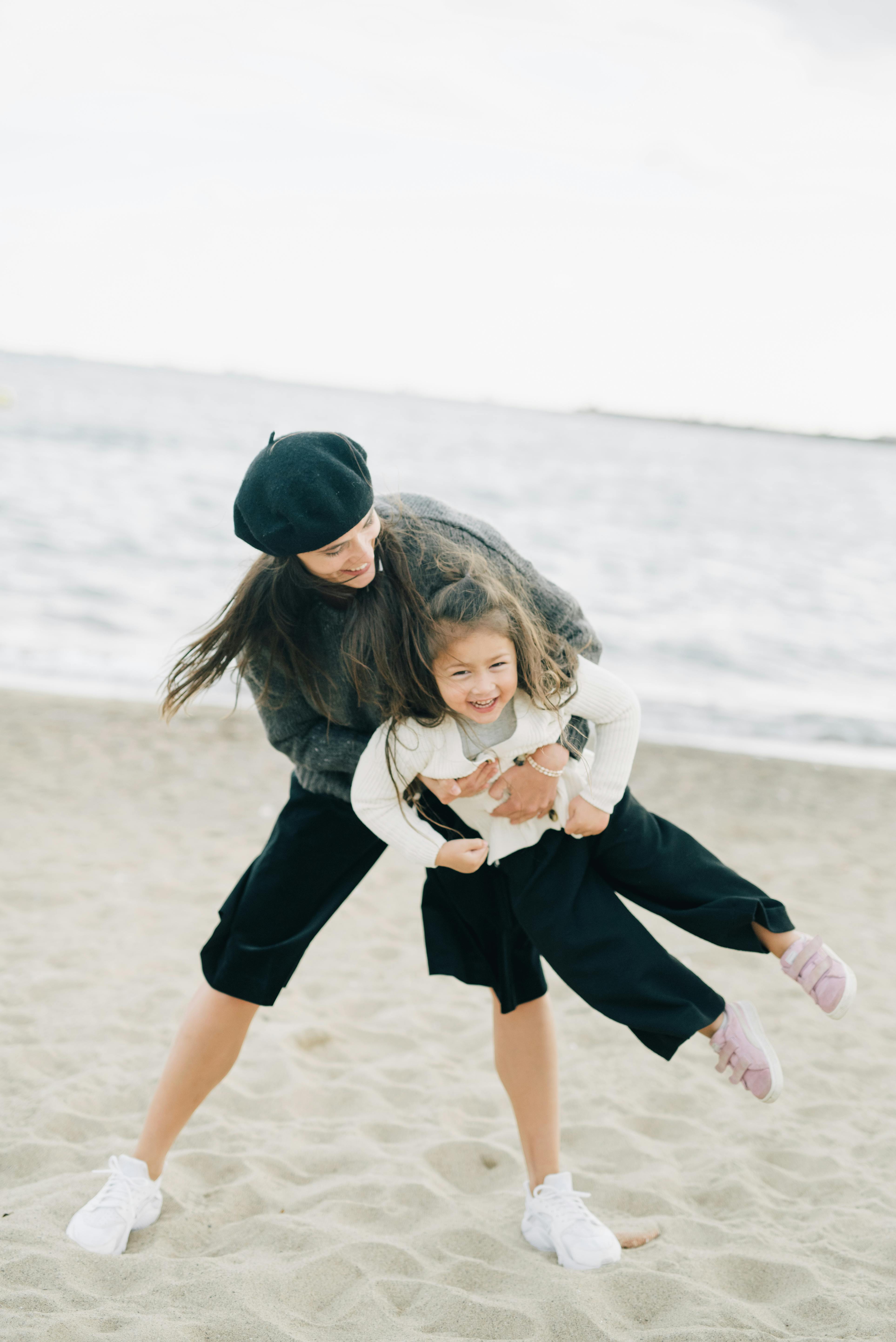 Mother and Daughter Playing on Beach
