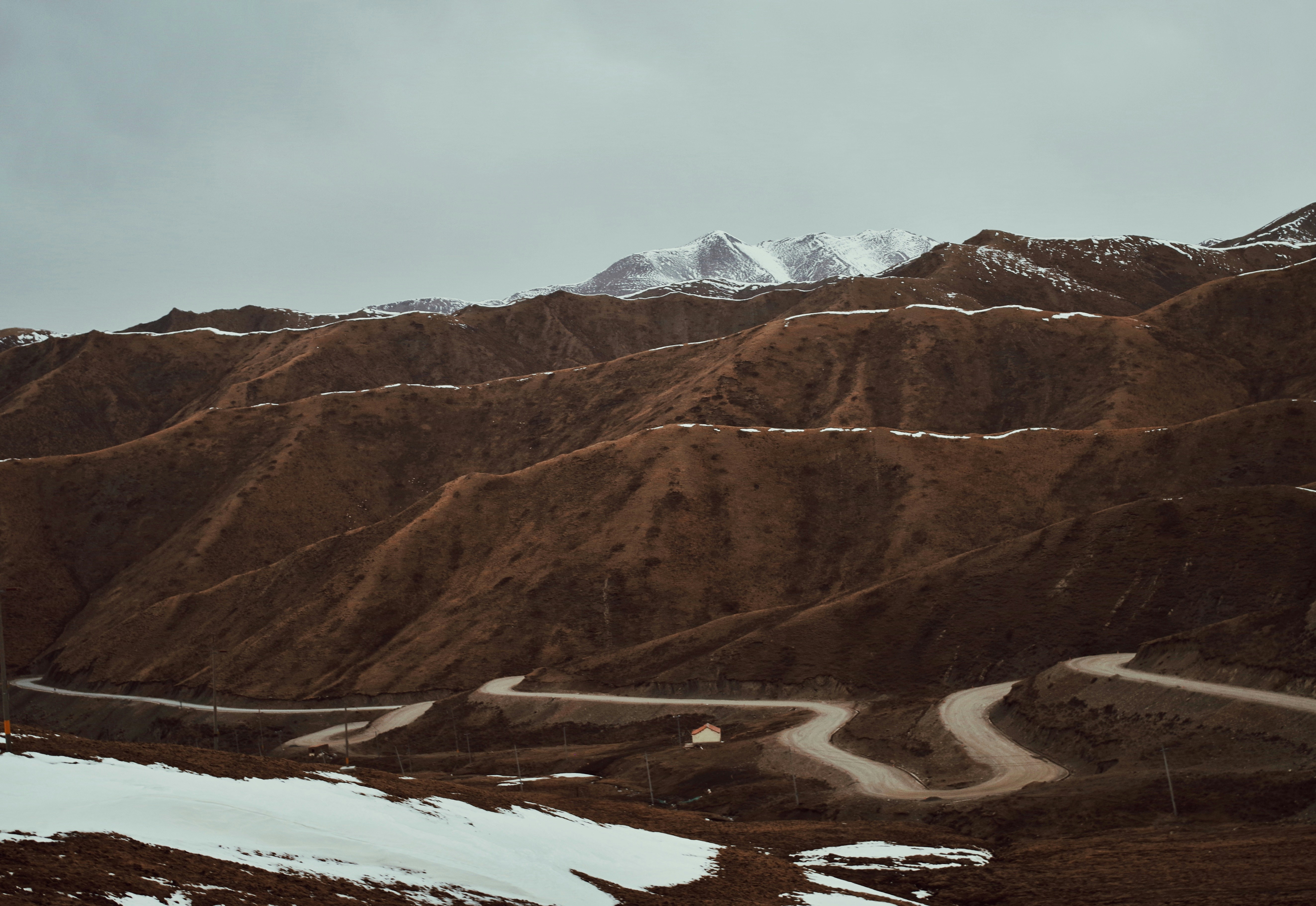 Winding Mountain Road With Residual Snow